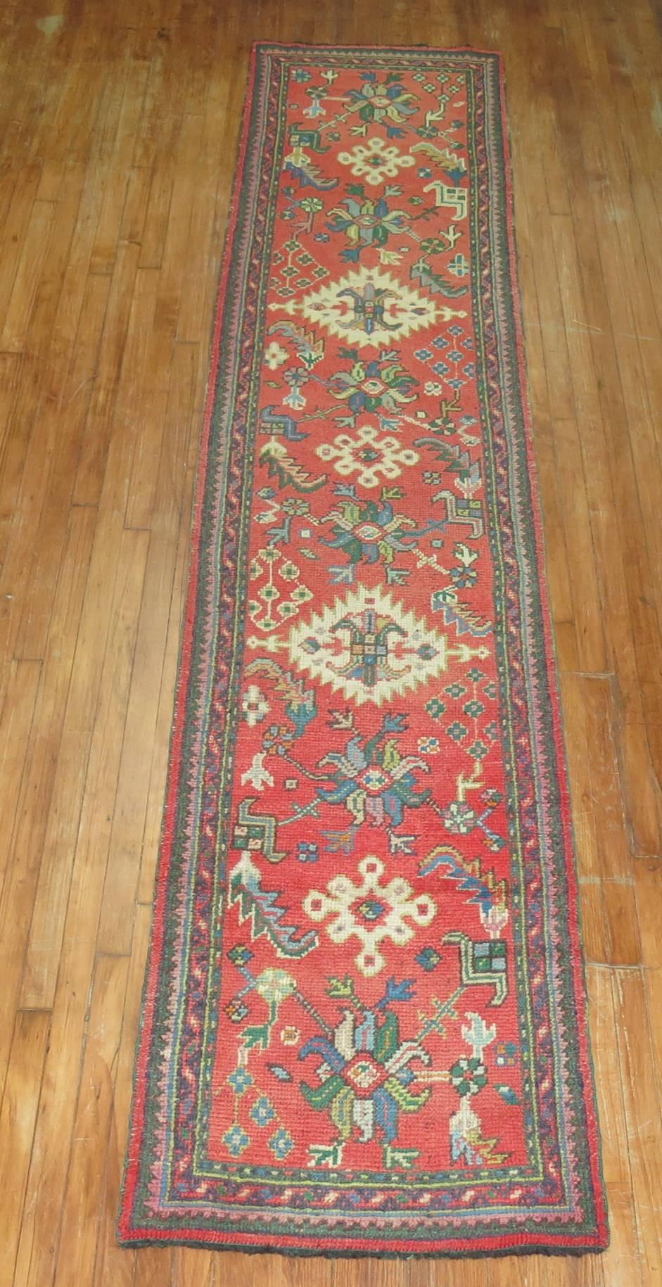 Authentic antique Turkish Oushak runner in predominant tomato red, accents in green, blue and beige

Measures: 2'5