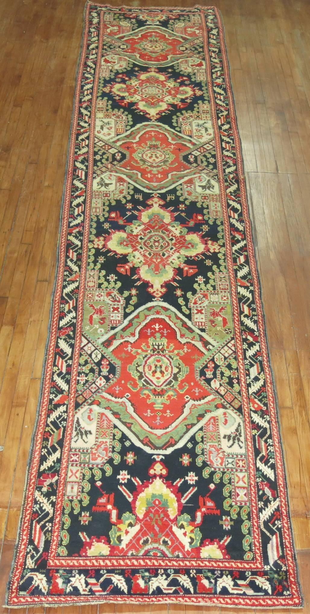 An early 20th century Russian Karabagh runner, predominant accents in red, yellow, and green on a black colored field and border.

3'6'' x 18'

Karabagh are one of the more popular types of Caucasian rugs that were woven on the higher mountain