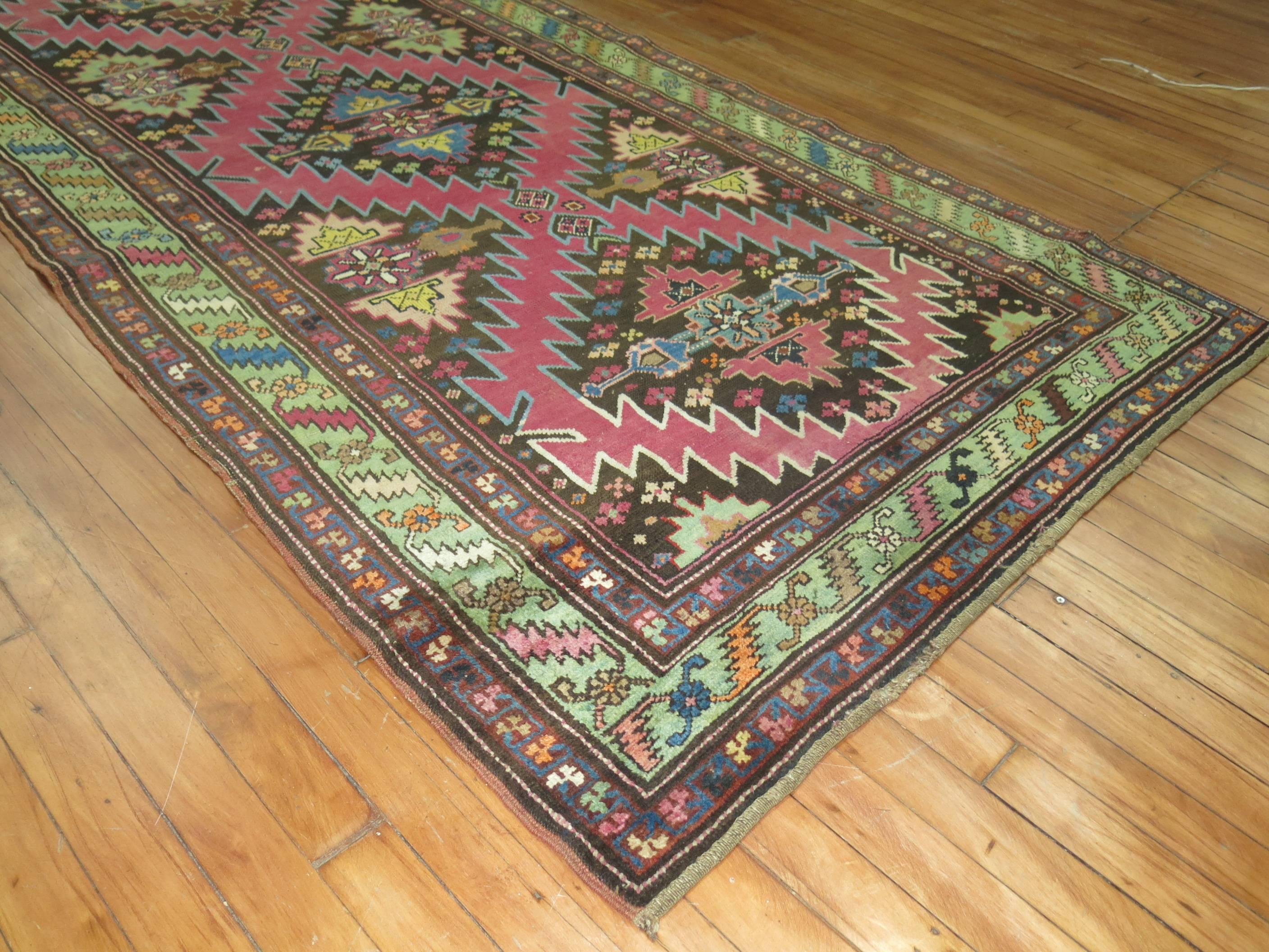 Vintage Karabagh runner predominant accents in pink and chartreuse on a brown colored ground.

3'10'' x 12'9''

Karabagh are one of the more popular types of Caucasian rugs that were woven on the higher mountain regions of the Caucasus villages that