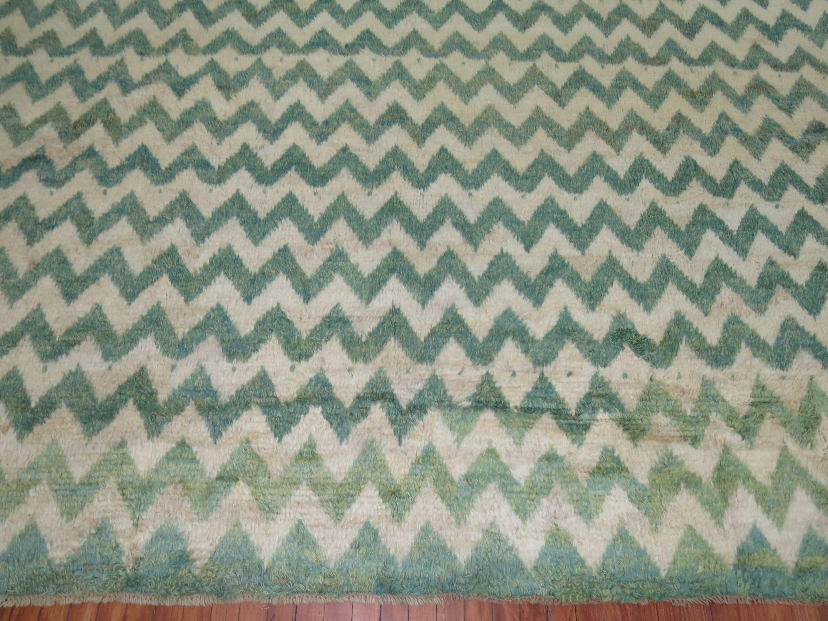 Modern Persian square rug with an all-over chevron motif in greens and ivory. Made with recycled wool derived from 20th century Turkish rugs.
Measures: 12'2