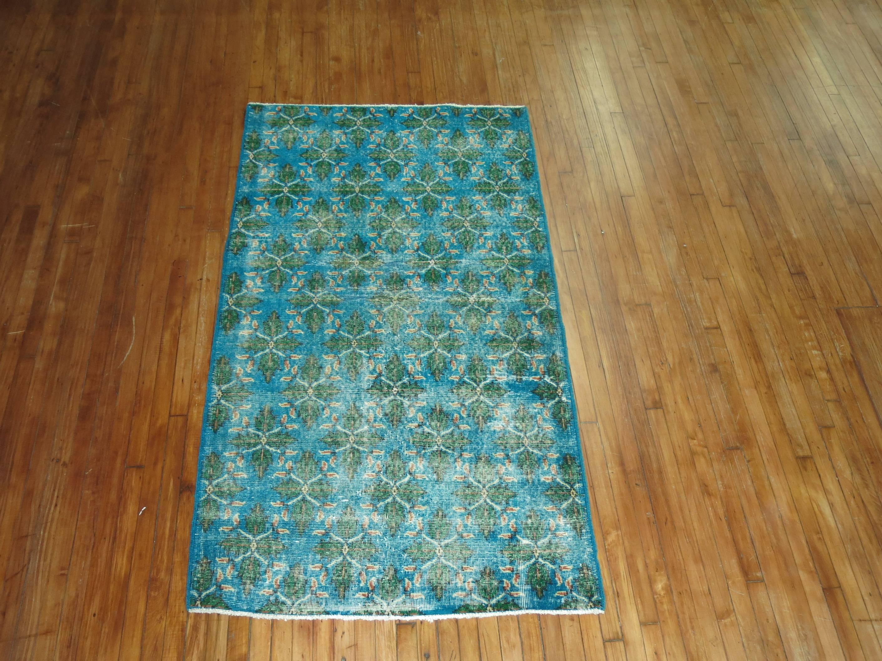 Worn Mid-Century Turkish Konya rug in Caribbean blue and green.