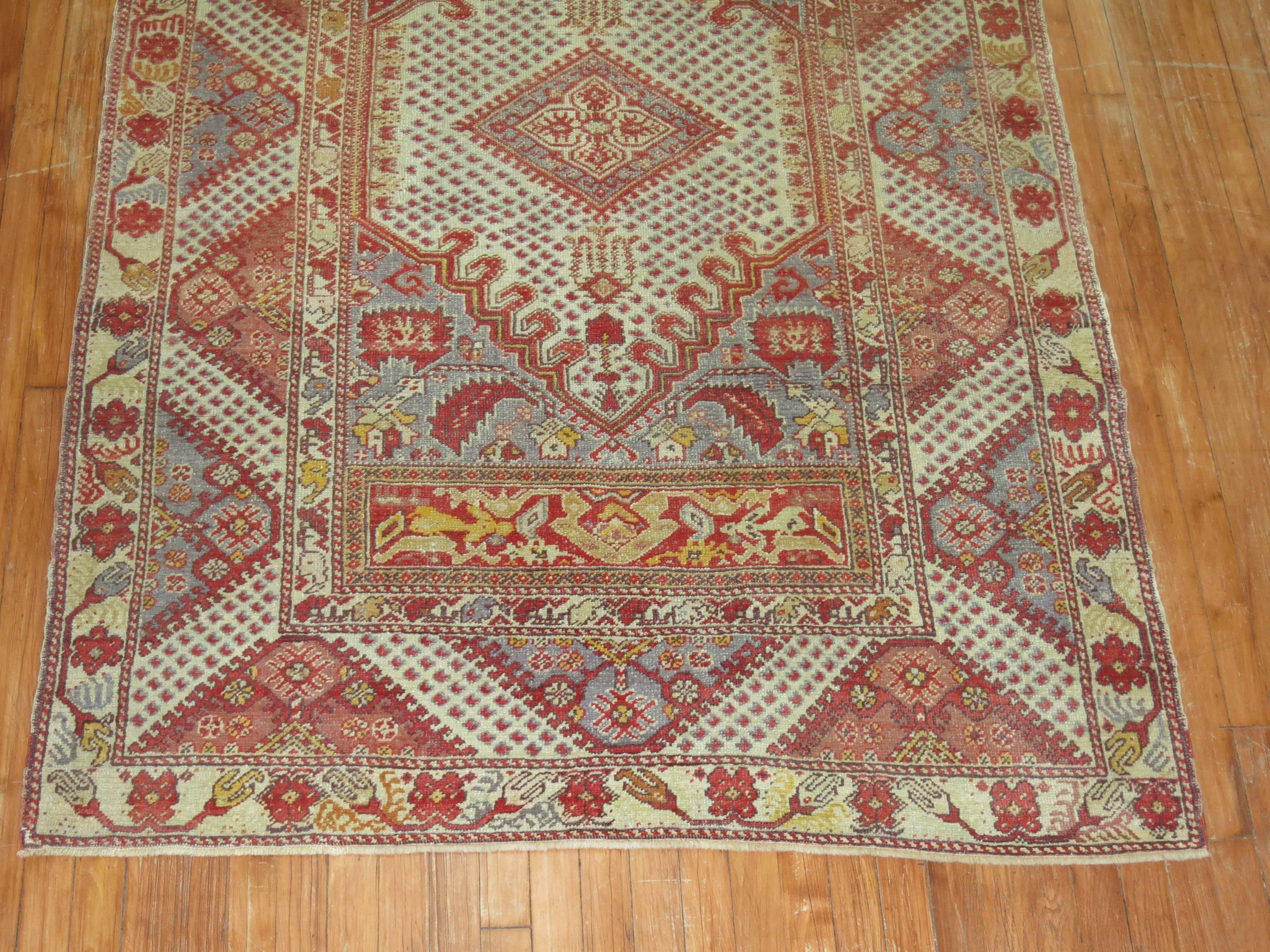 Authentic one of a kind Turkish Ghiordes rug.

4'7'' x 7'2''

Since the beginning of their production in the 18th century, rugs from the Turkish town, Ghiordes have mostly been known for their rectilinear, colorful, multi-bordered antique prayer