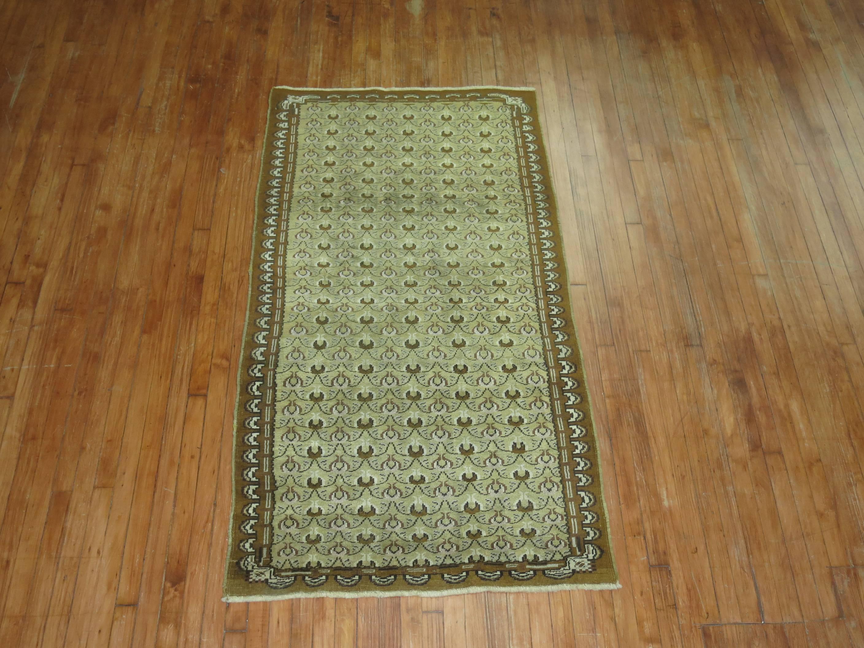 Mid-Century Turkish Runner with an all-over tulip motif in olive green and brown.

3'5'' x 6'7''