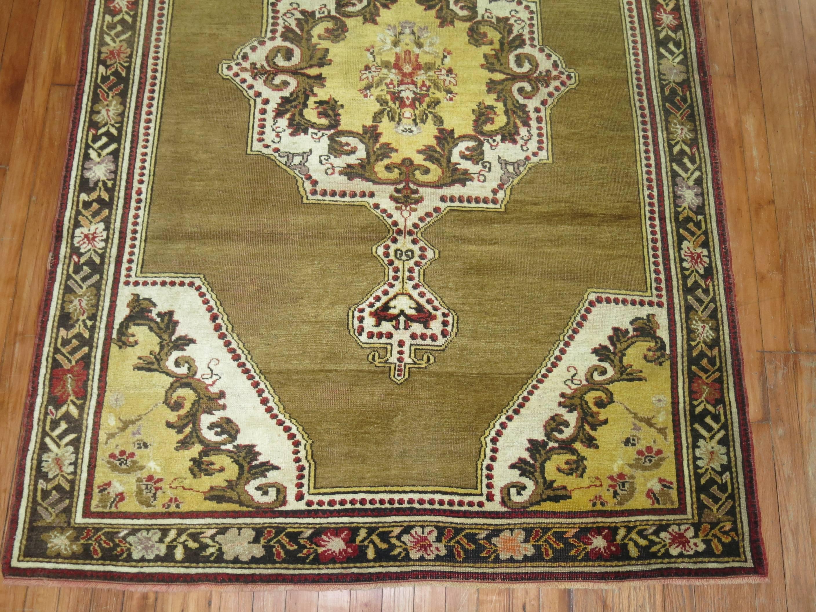 20th Century Olive Brown Yellow Turkish Medallion Ghiordes Rug For Sale