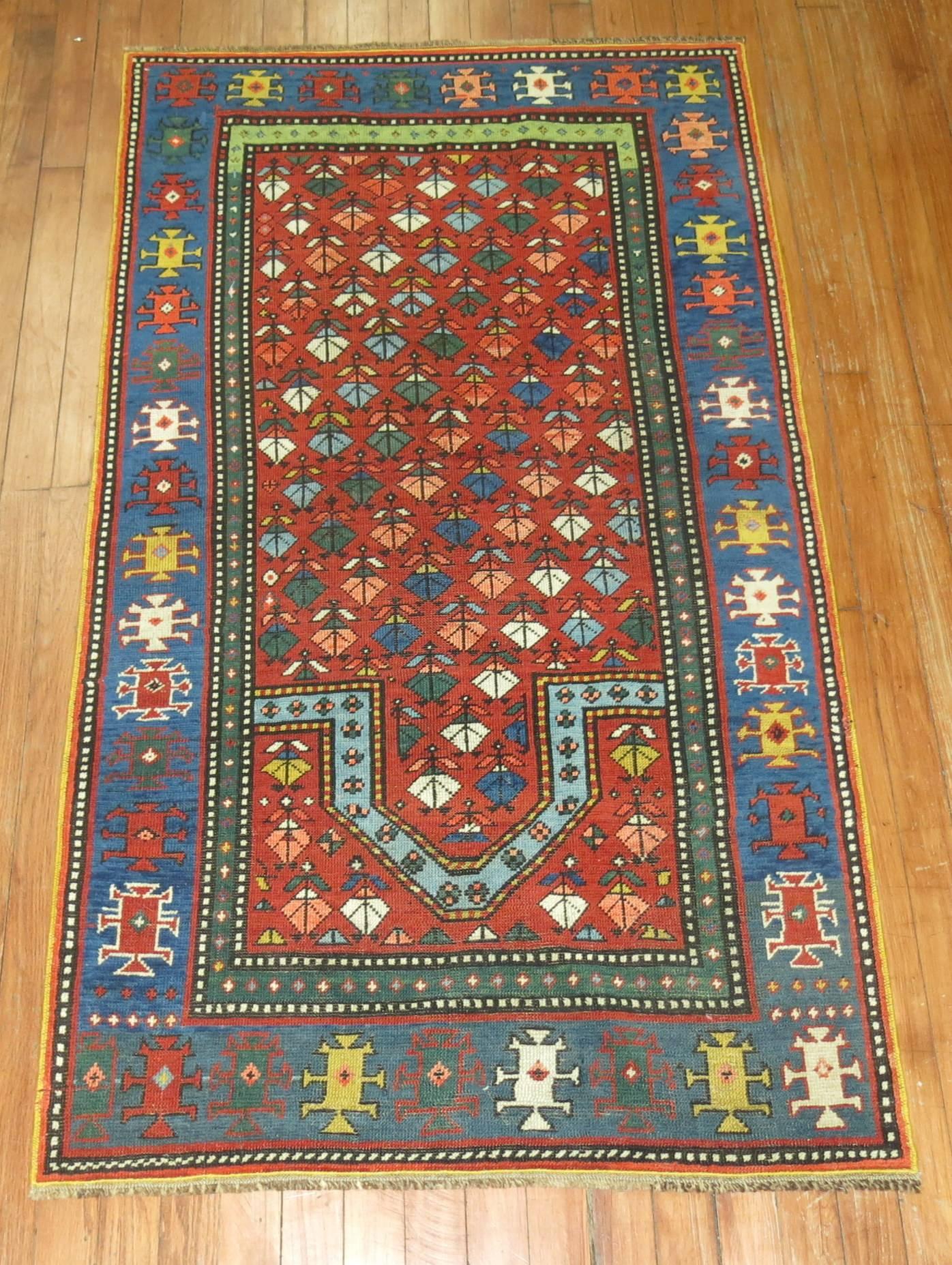 An early 20th century colorful Kazak prayer design rug.

2'9'' x 4'11''

The best antique Kazak rugs are long prized by connoisseurs of Caucasian rugs. Main reason for this is their incredibly saturated naturally dyed color tones that account for