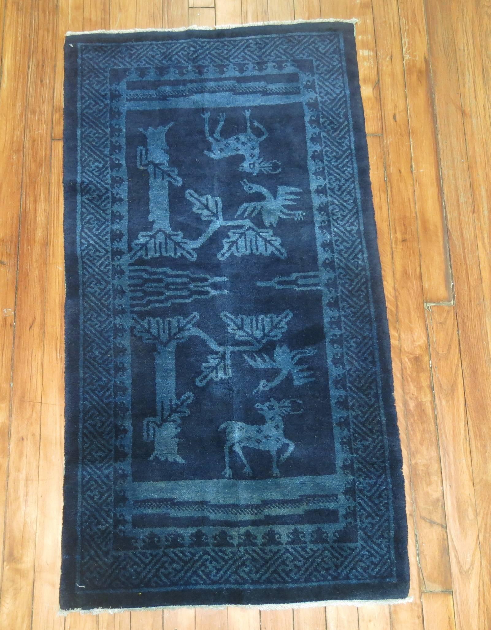 A Chinese peking carpet in midnight blue.
