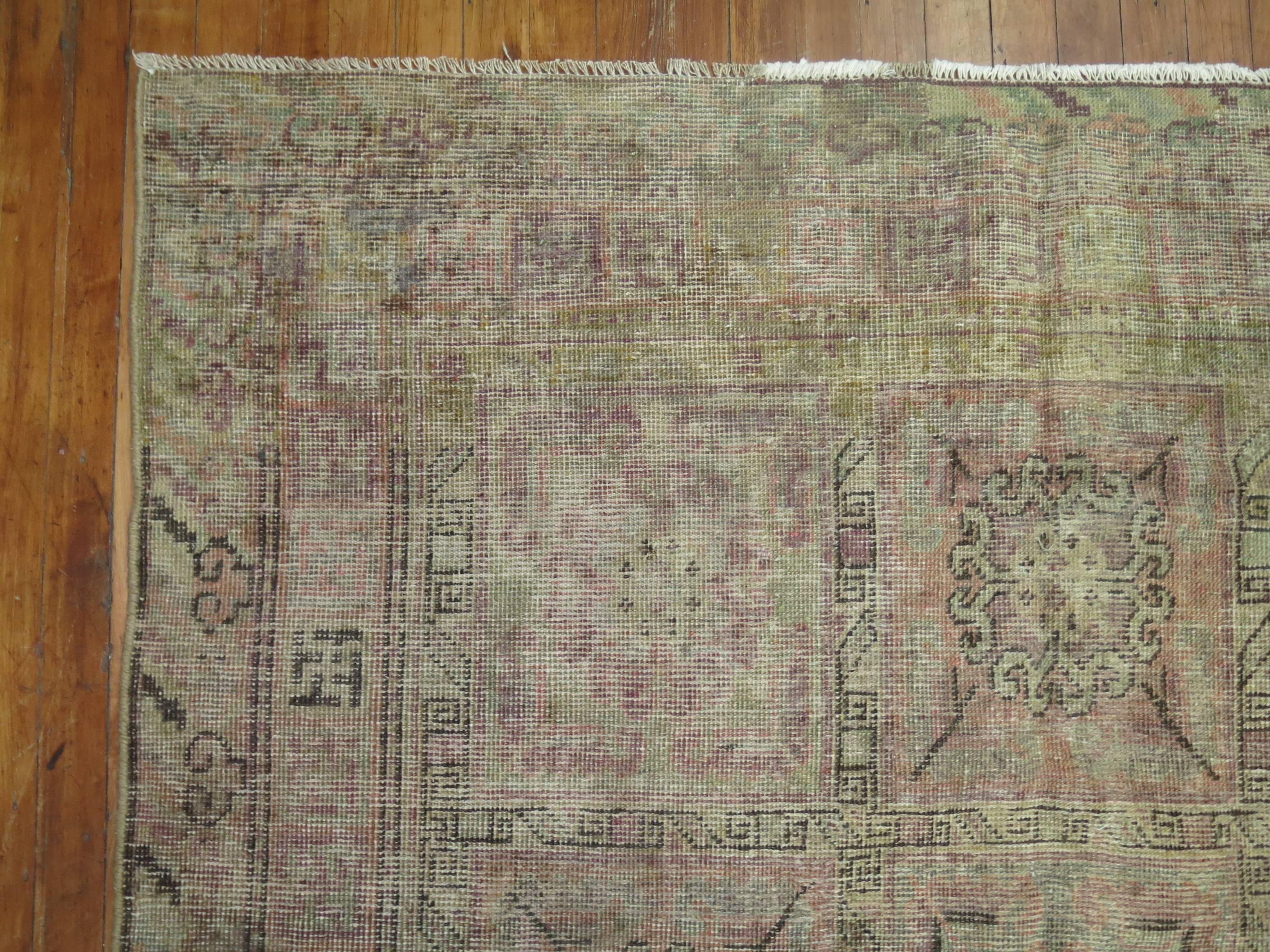 Antique shabby chic Khotan rug gallery size rug with faded grays, pinks, lavenders.

4'11'' x 10'3''