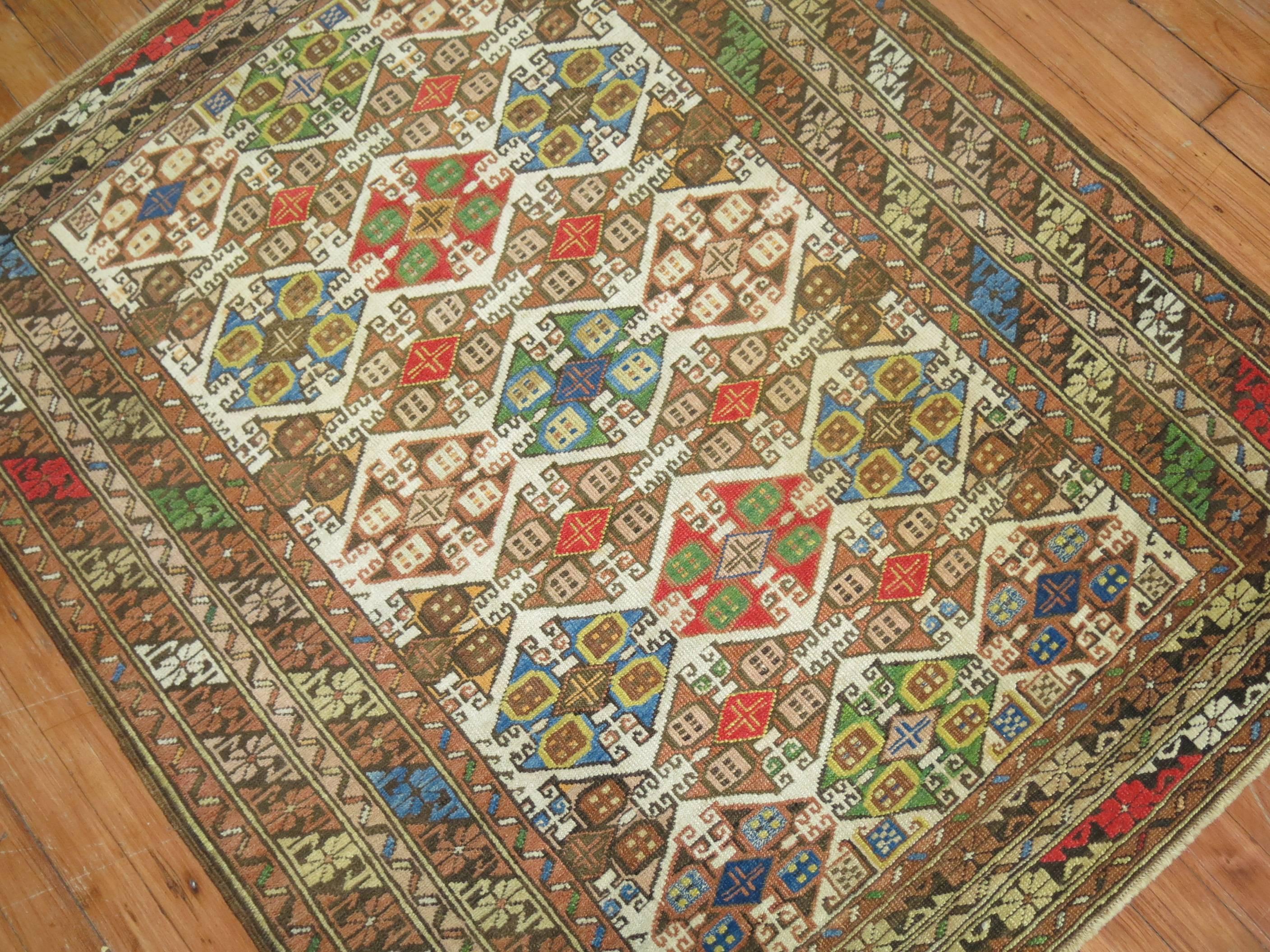 Zabihi Collection Colorful Antique Caucasian Rug In Good Condition For Sale In New York, NY