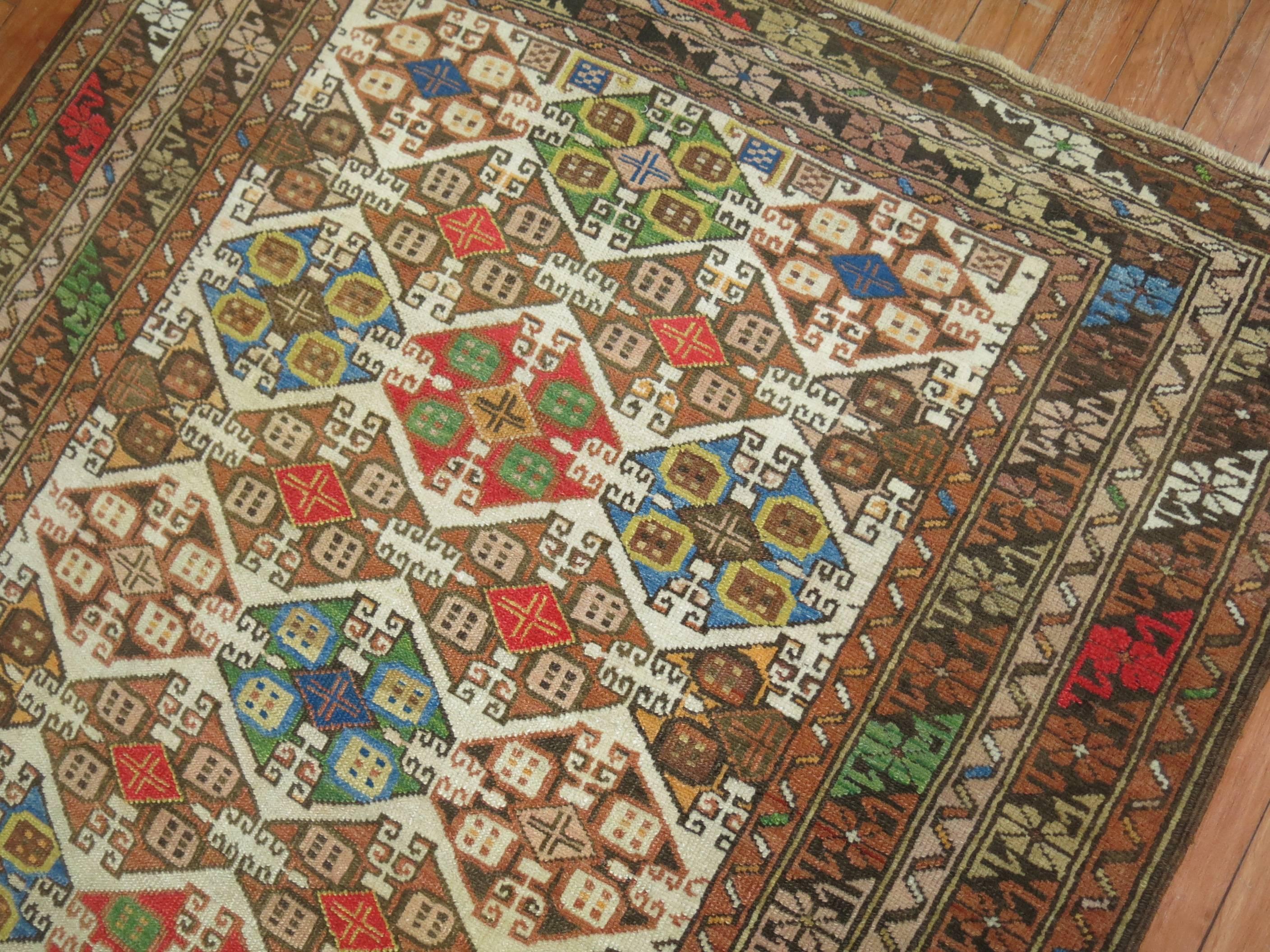 20th Century Zabihi Collection Colorful Antique Caucasian Rug For Sale