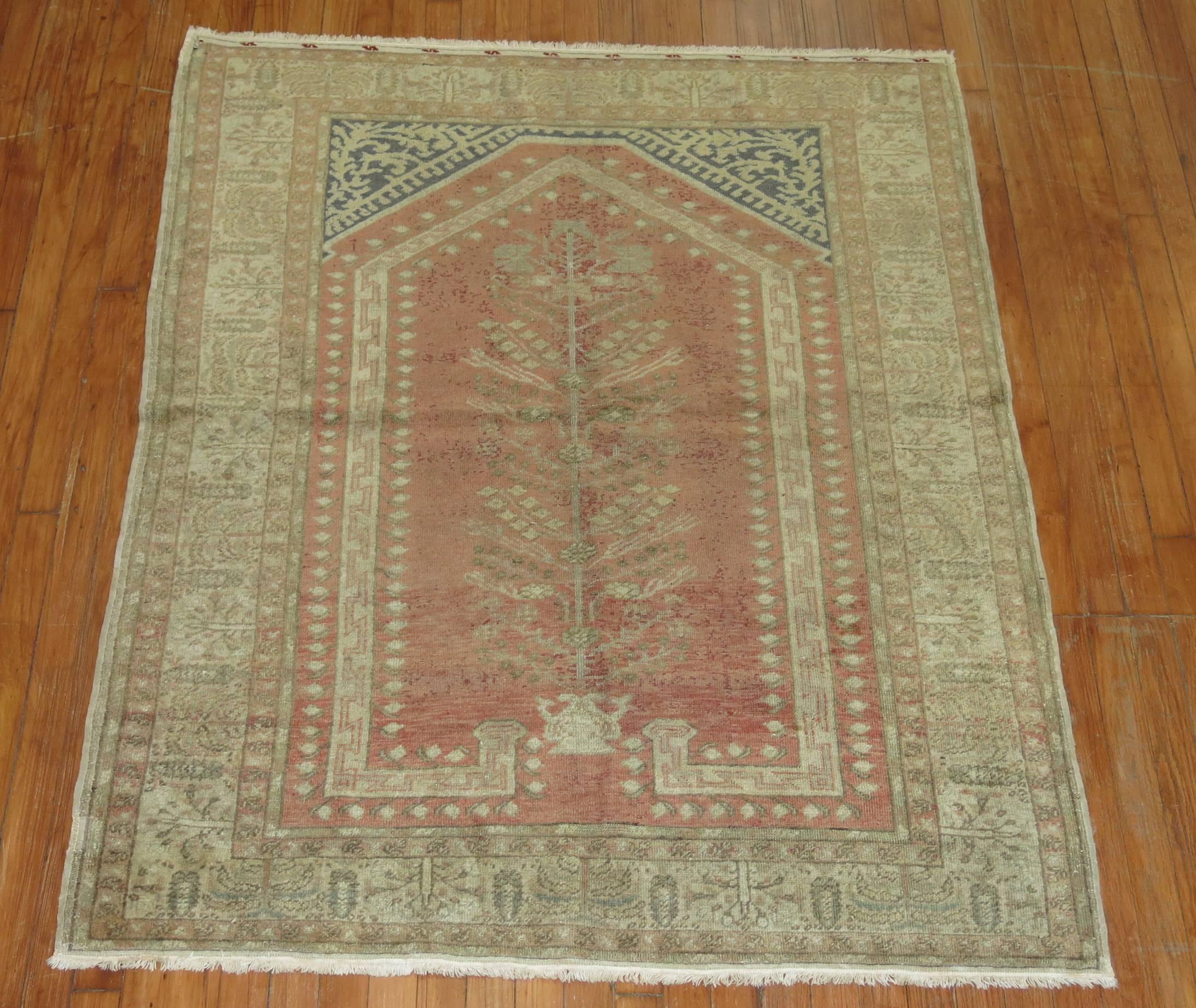 An early 20th century Turkish rug with a whimsical tree of life Directional motif.

4'2'' x 5'4''