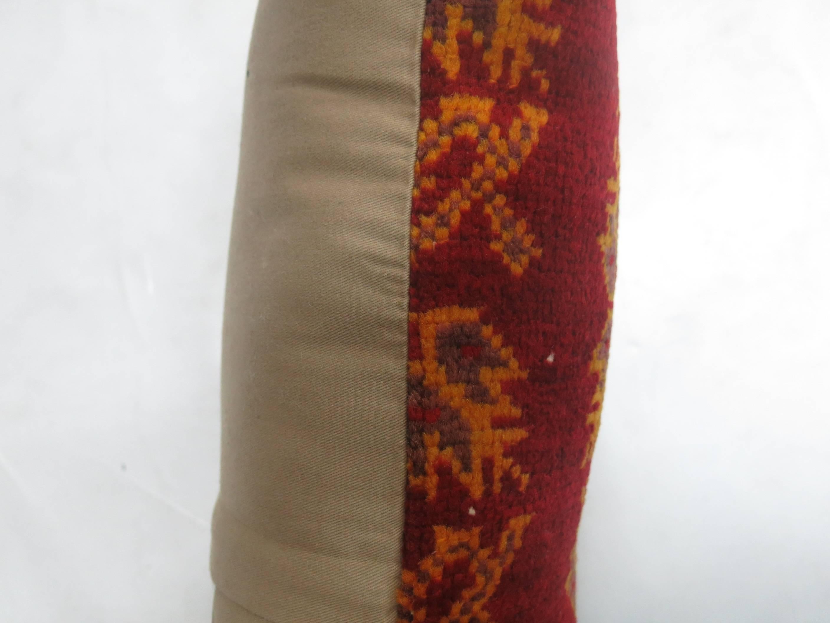 Lumbar size pillow from a red Turkish Anatolian rug.