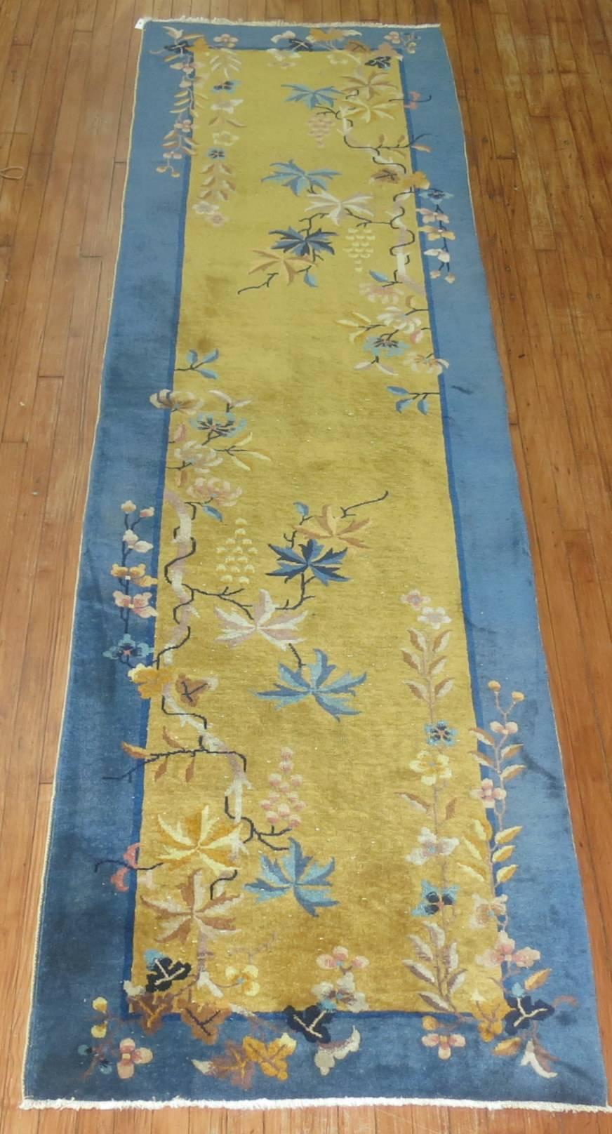 Beautiful Chinese Art Deco runner with a mustard yellow field and medium blue border. Chinese rugs don't often come in runners like this rare example.