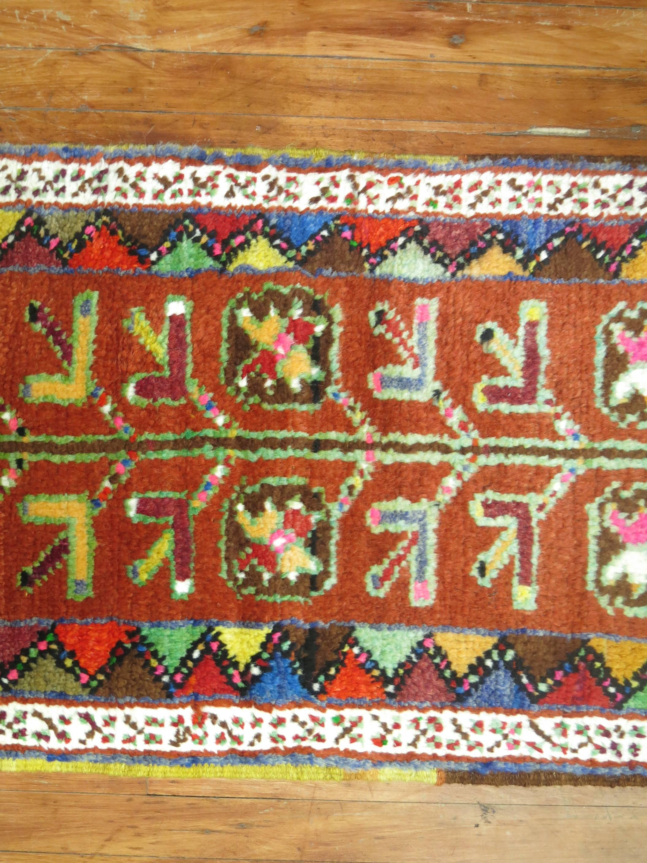 Colorful midcentury narrow and long Turkish Anatolian runner. Orange field with lime green, turquoise, hot pink and blue accents. Size is original which makes it more spectacular.

1'11'' x 16'10''.