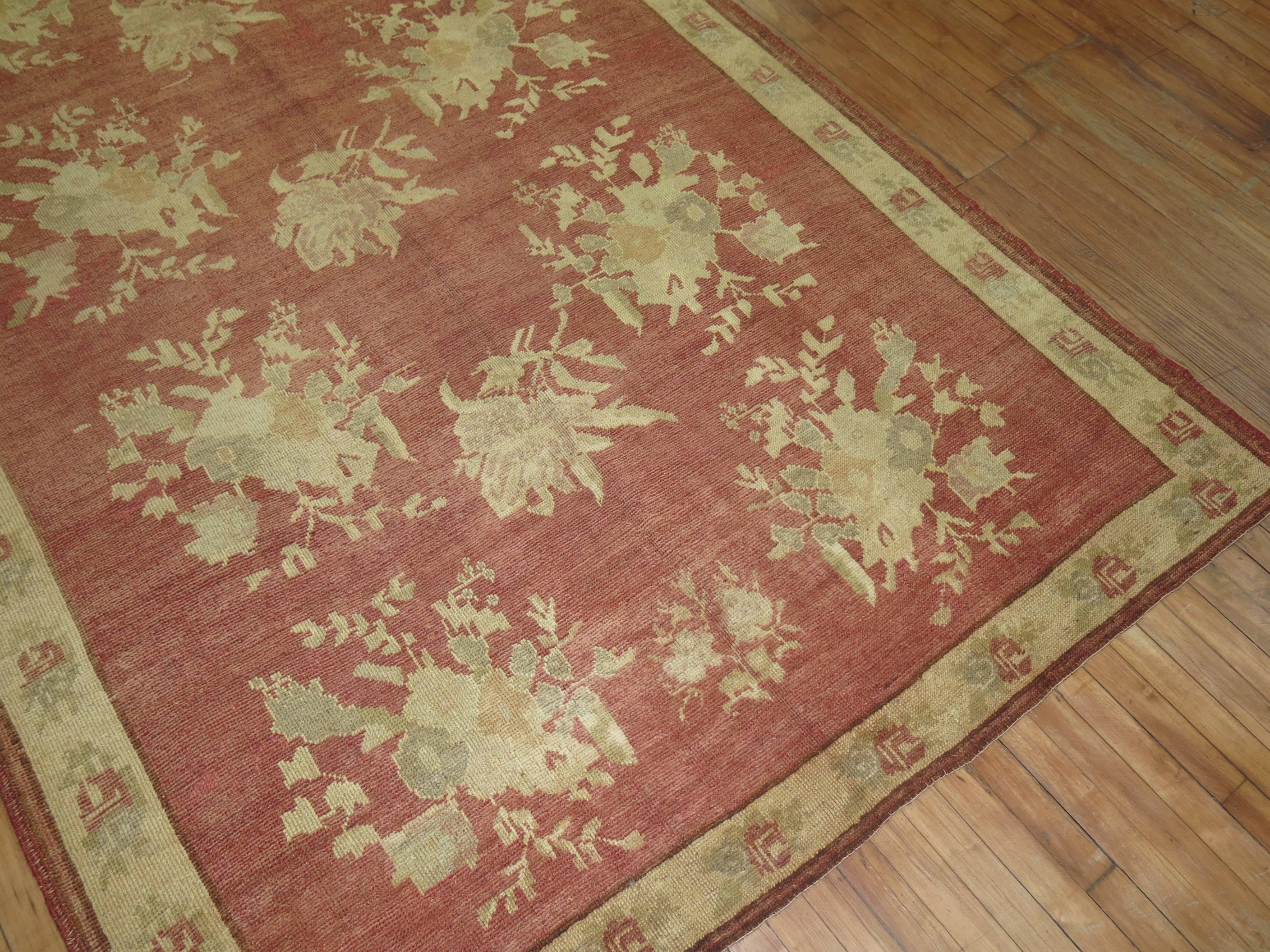 Exquisite Vintage Turkish rug with an all over floral design and border in rose and khaki.