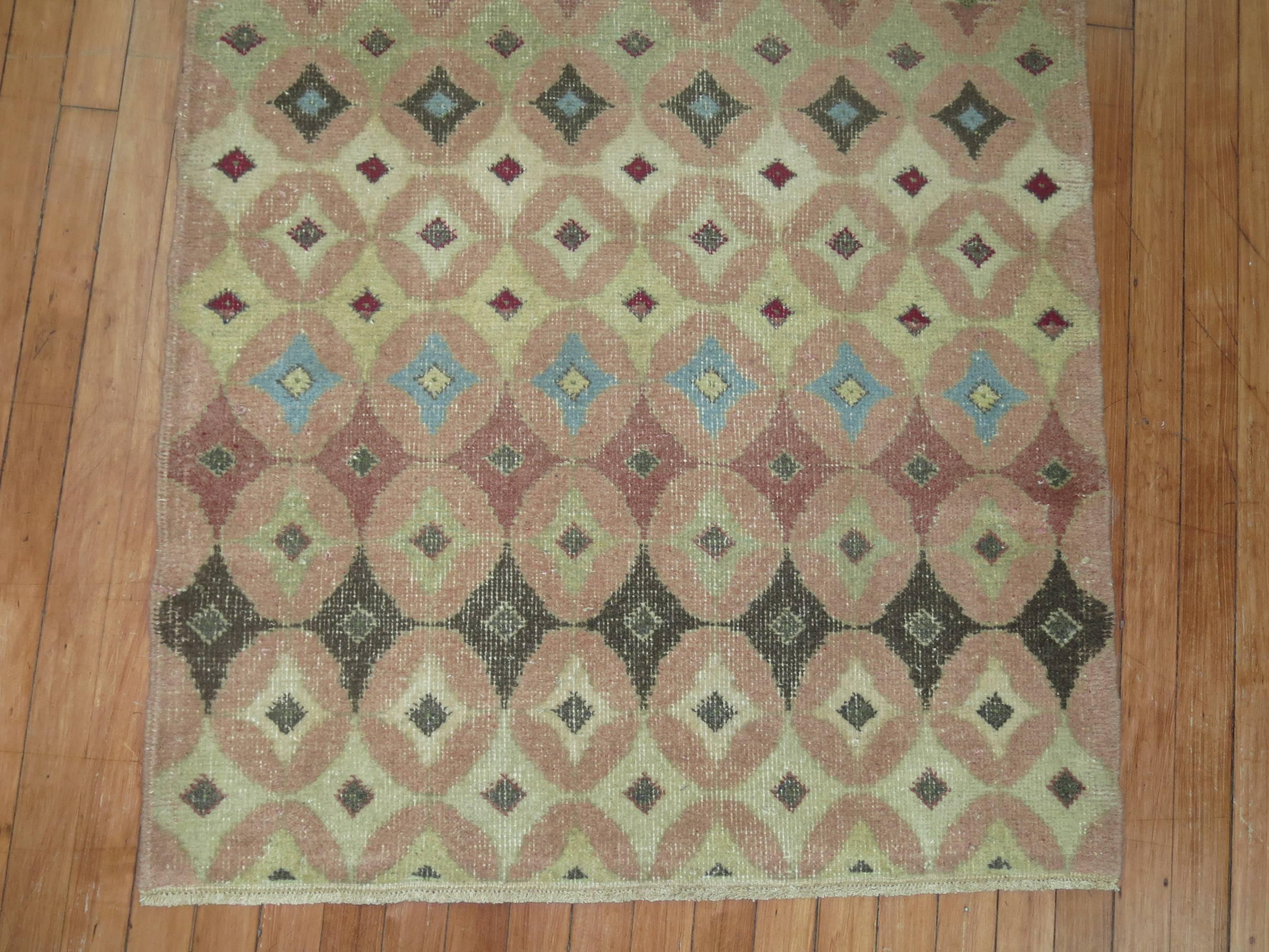 Pair of vintage Turkish deco rugs in an assortment of colors. 

Measuring: 3' x 4' and 3'1” x 4'3” respectively.