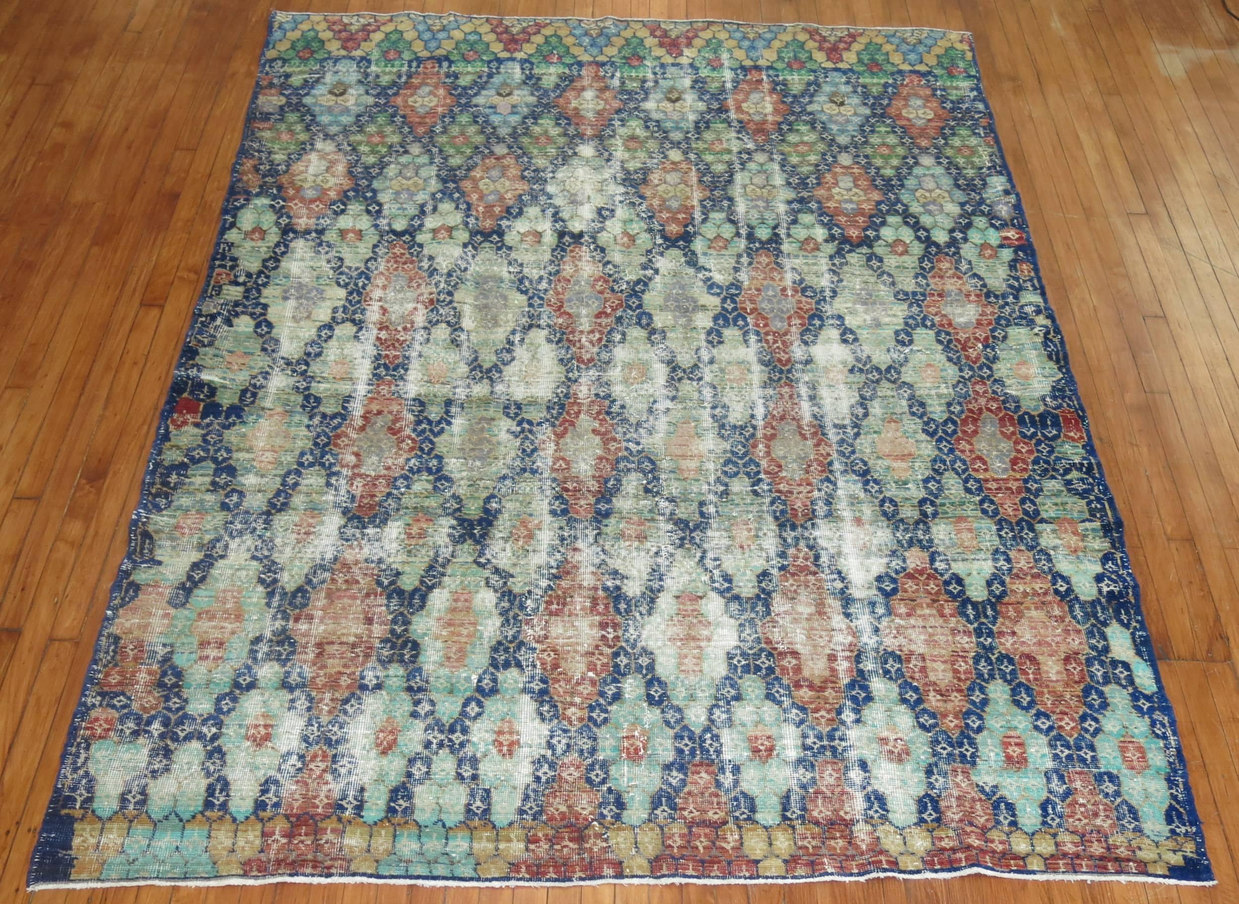 Shabby chic Turkish Anatolian carpet, navy blue field, predominant accents in green, soft red, soft orange, blue and gray.

6'11' x 9'8''
