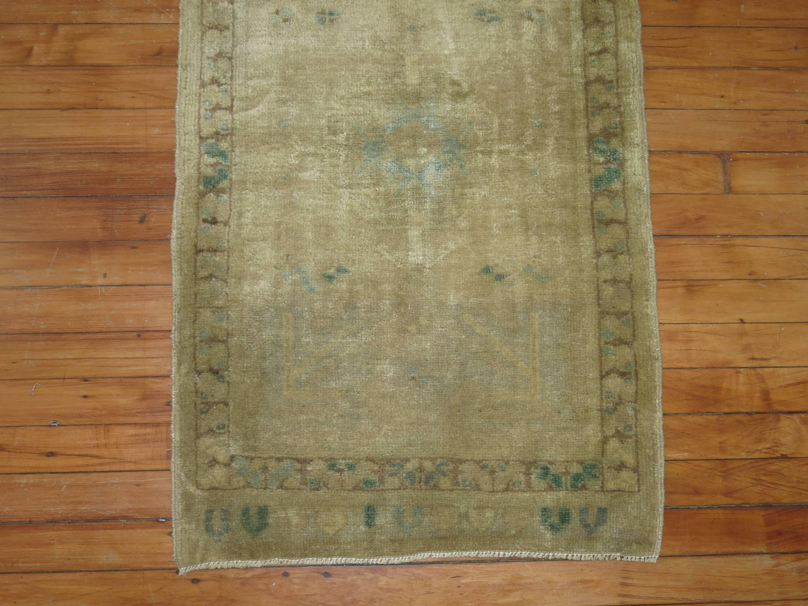 Vintage Oushak rug suitable for a bathroom, powder room or entryway. Pops of blue and green accents.