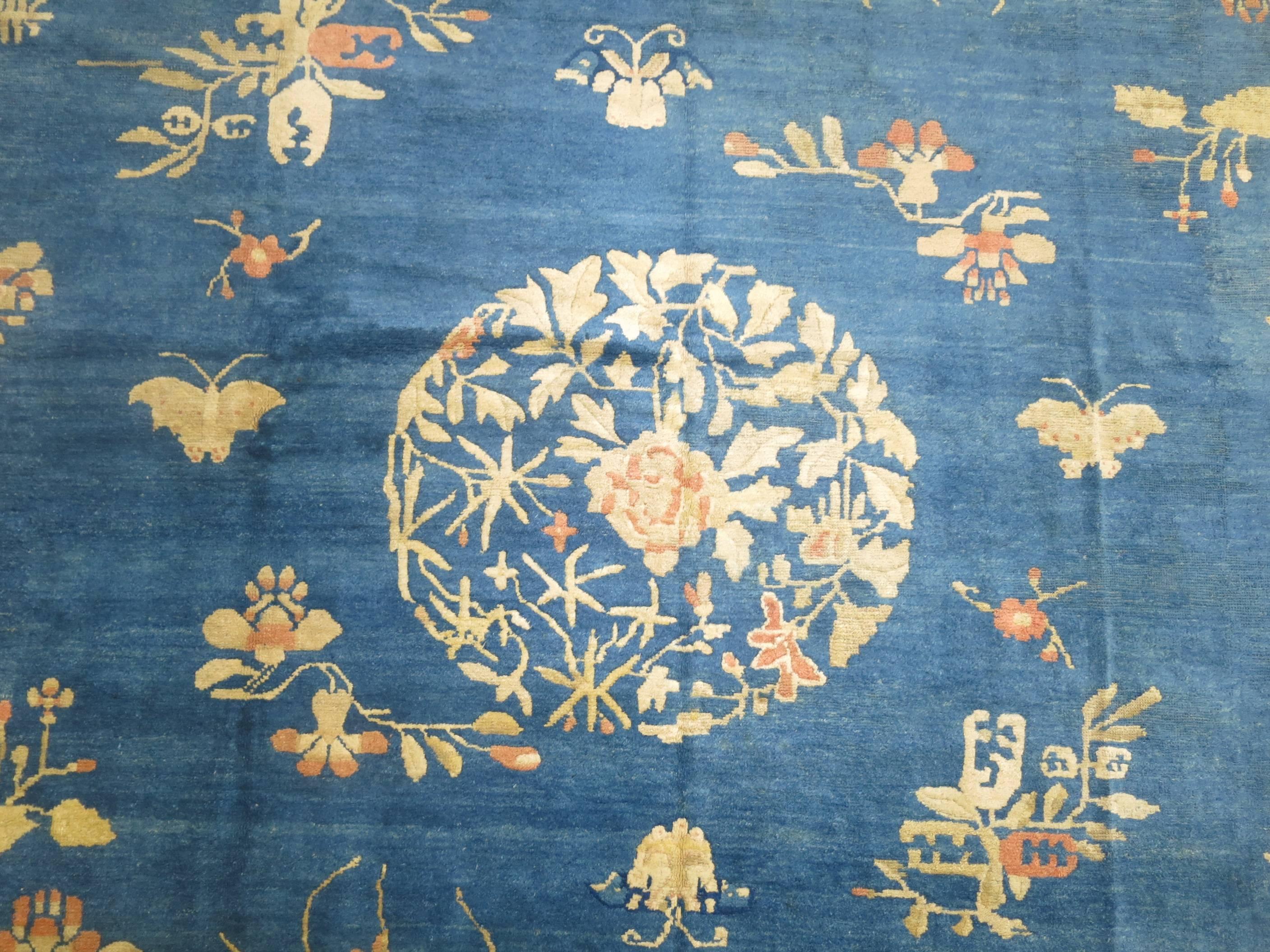Enchanting early 20th century Chinese Peking carpet with a soft blue background, beige border and soft accents in peachy apricot.

8'10'' x 11'3''