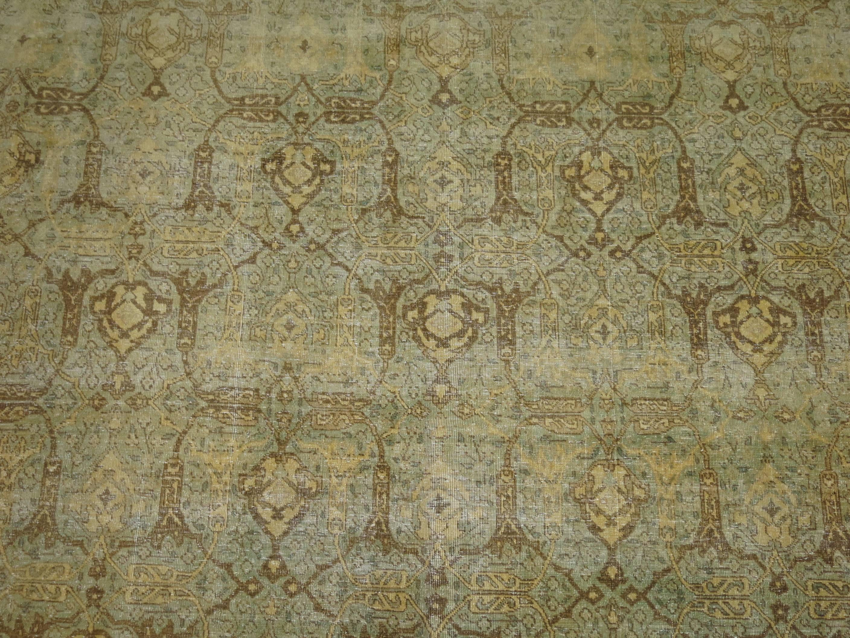 An early 20th century abrashed antique washed oversize Persian Isfahan carpet.

10'5'' x 15'7''
                  