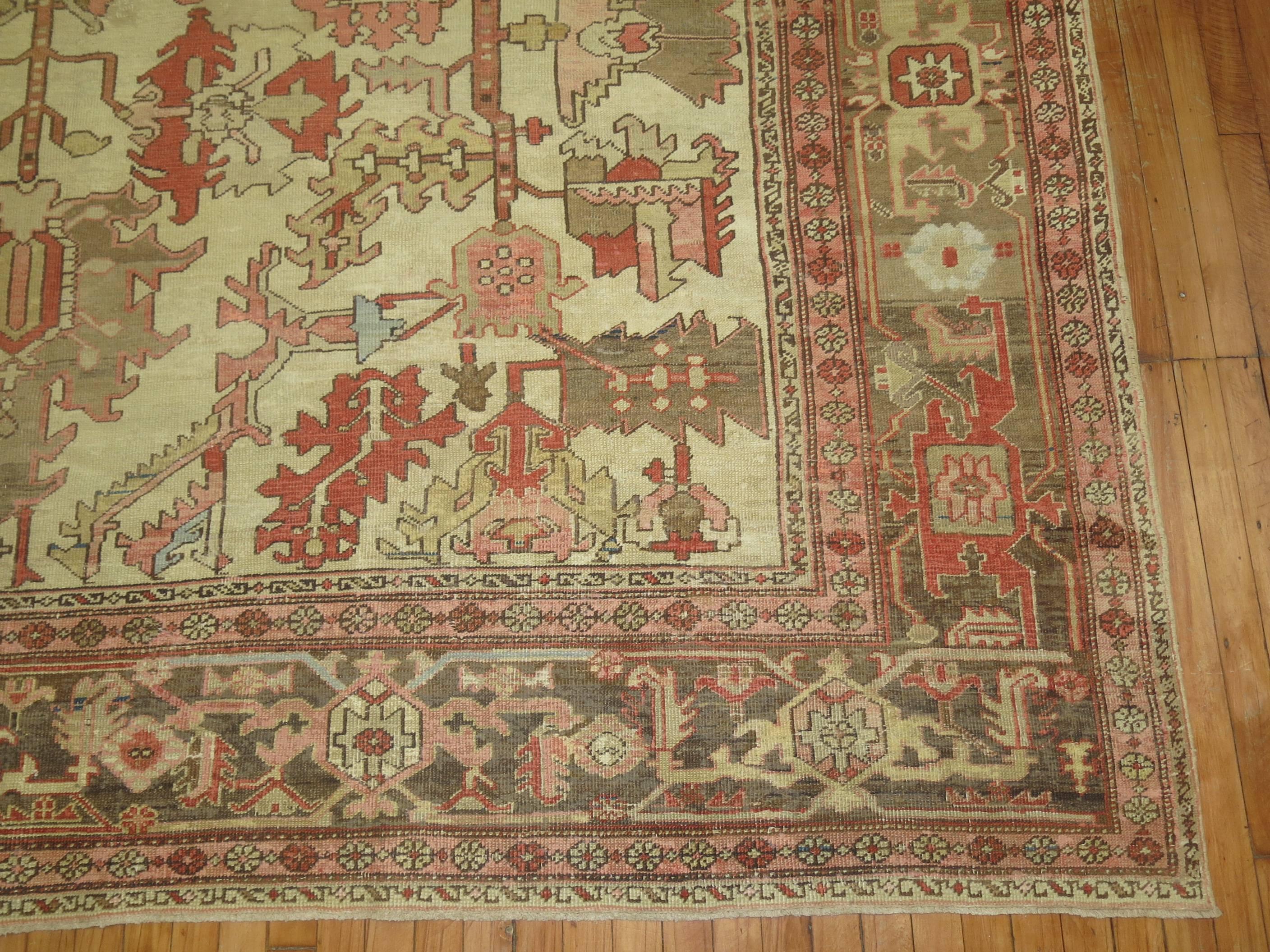 Wonderful antique Persian Heriz Serapi rug . Ivory field , soft brown borders with predominant accents in blue grey & terracotta.

The finest antique Persian Serapis are geometric in design with open spacious patterns in subtle colors. The great