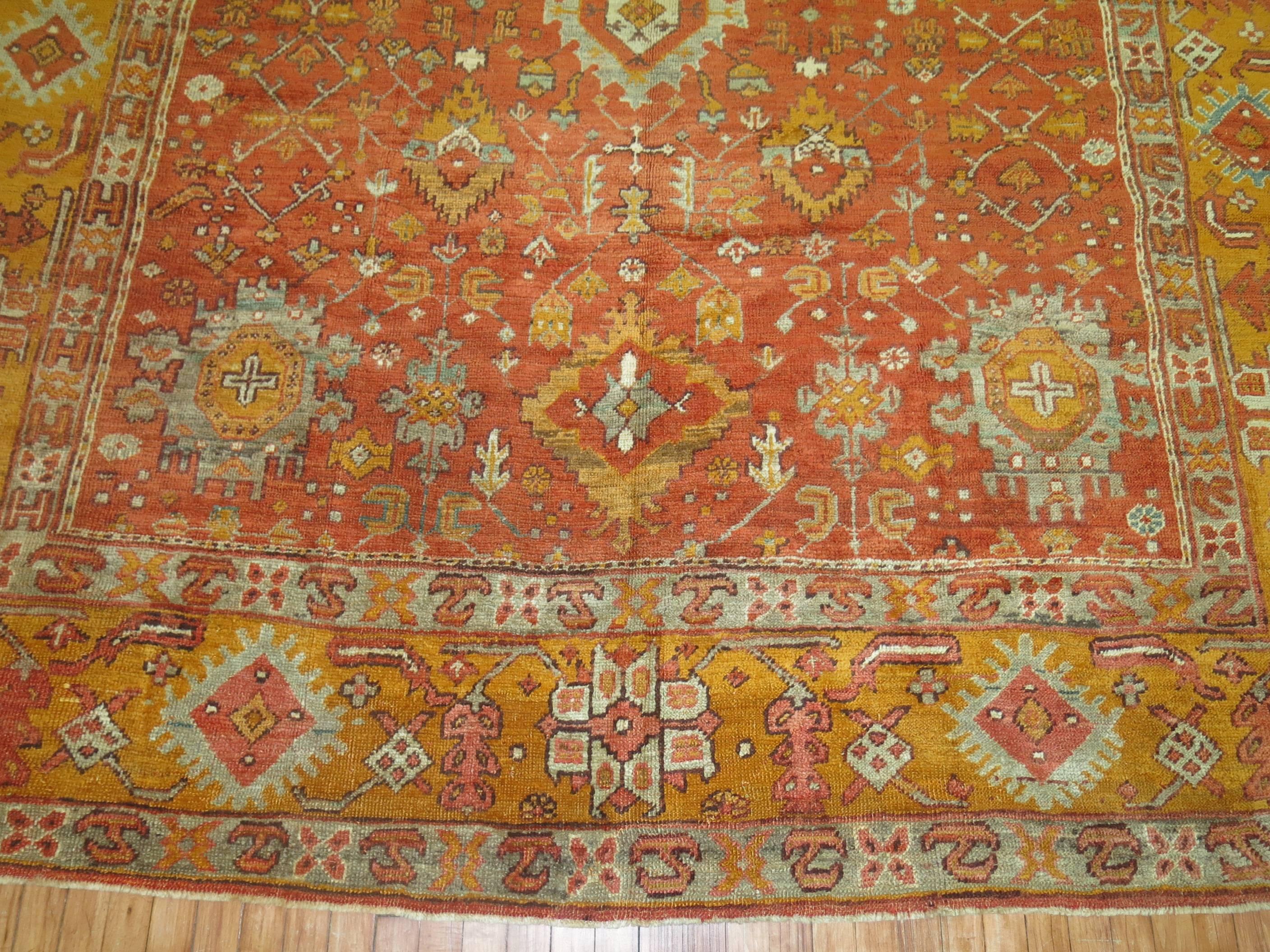 An exhilarating late 19th century antique Turkish Oushak rug in predominant orange accents. The finest quality of wool that you can find in any type of rug from this origin.