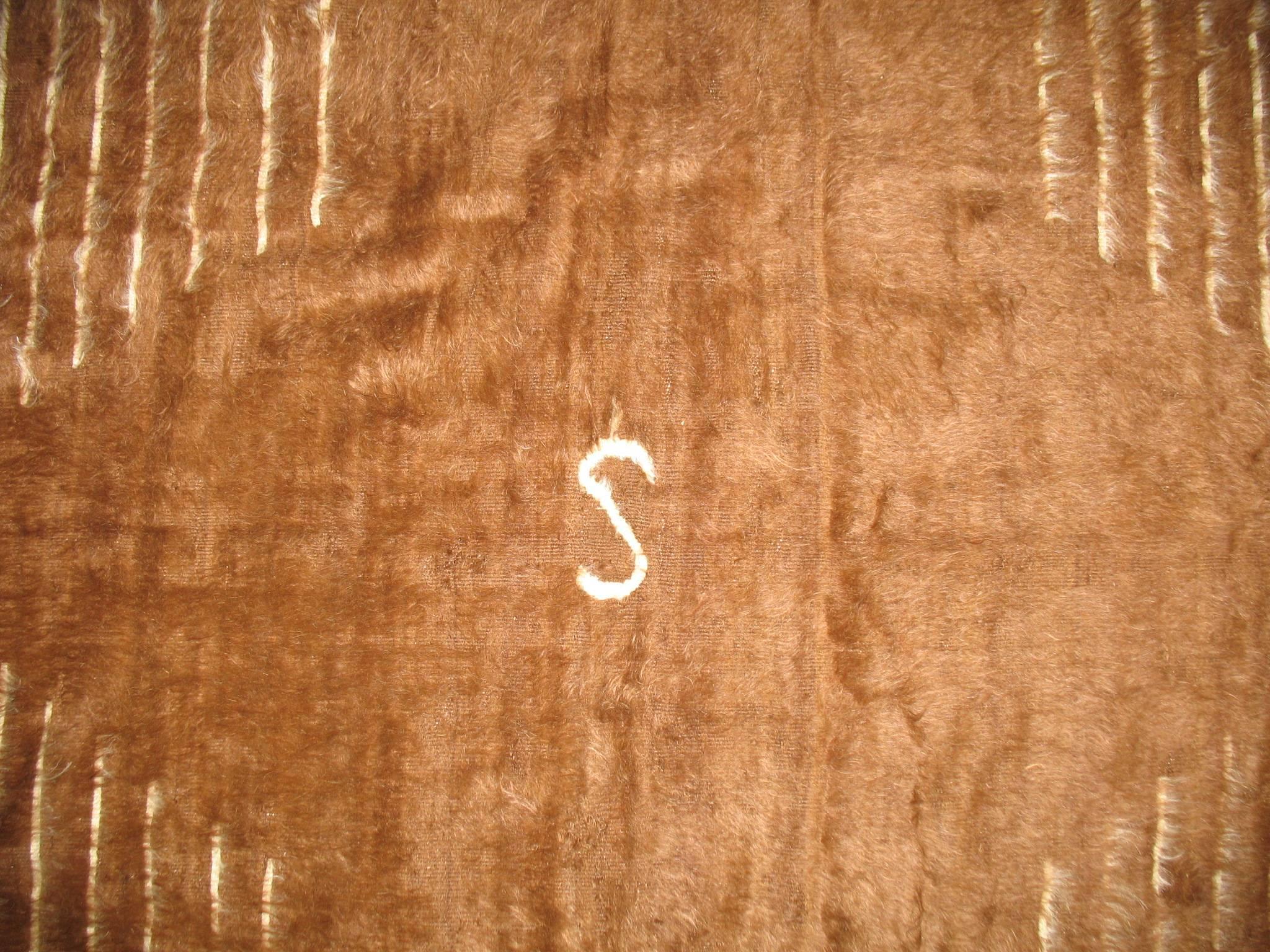 Casual looking vintage mohair rug with a nomadic motif with the letter 