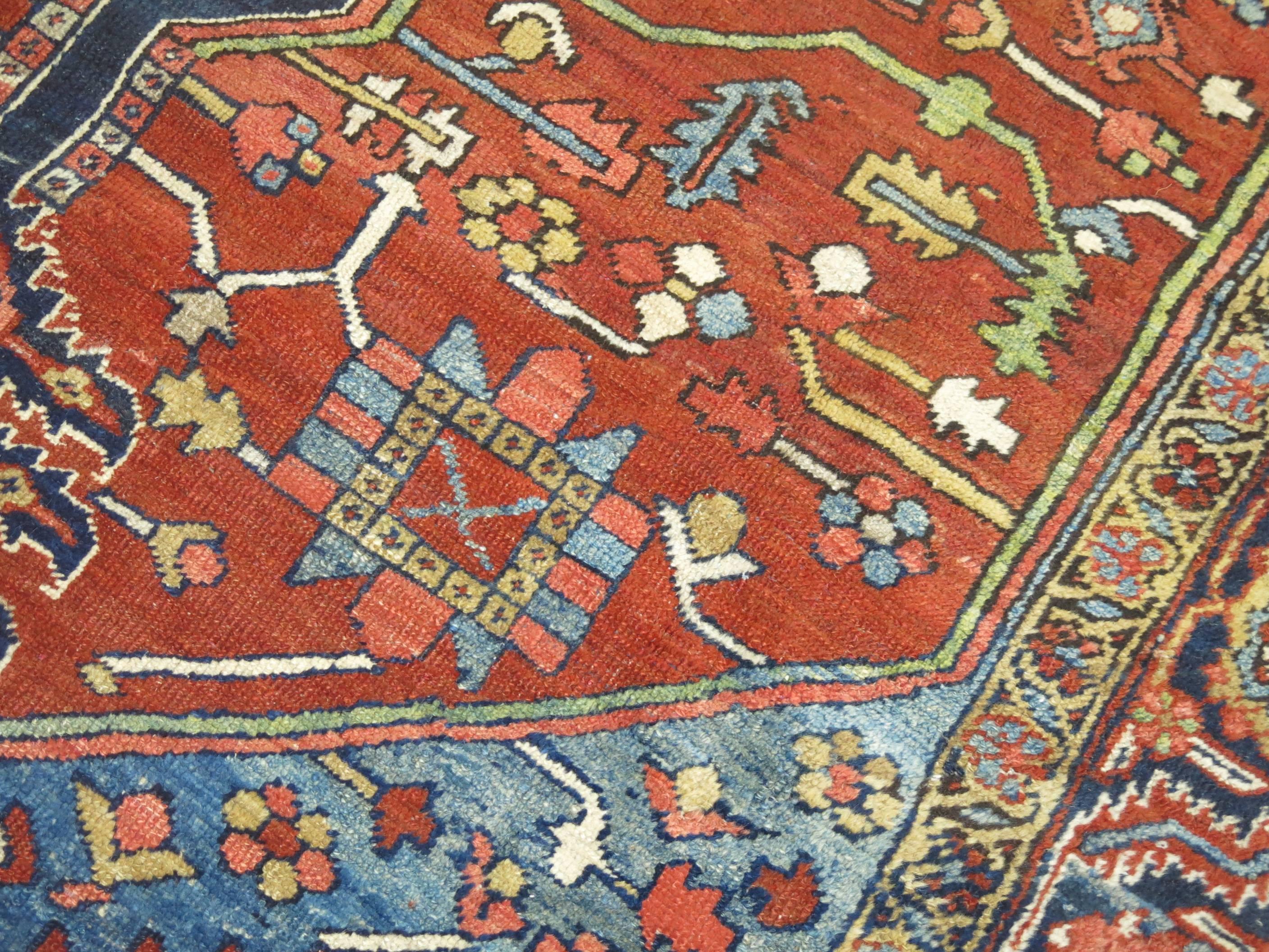 Lovely Persian Heriz rug featuring French blue colored corners on a spacious medallion and border motif.