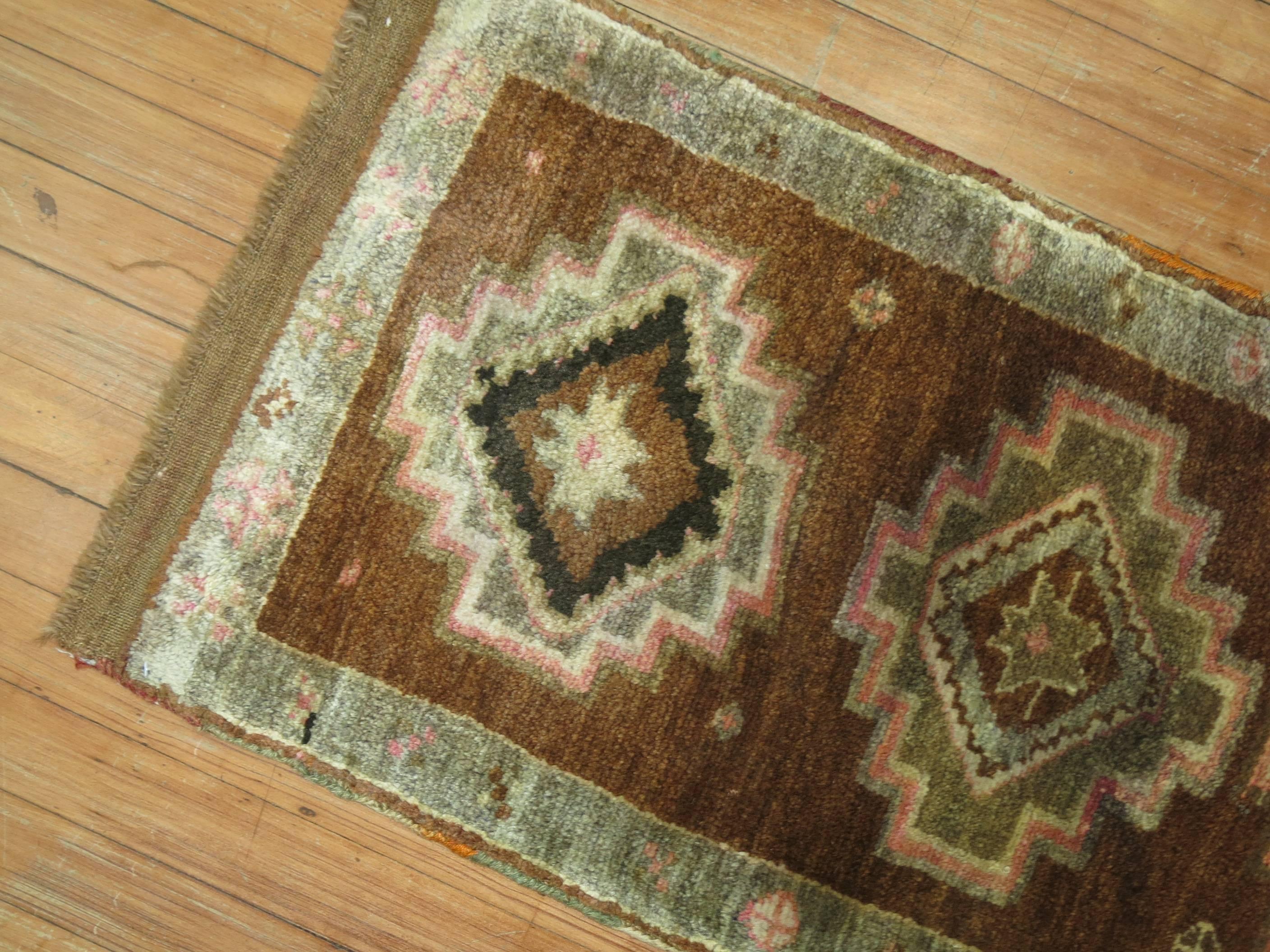 Vintage Oushak with an oatmeal brown field with 3 colorful medallions and a nomadic border.