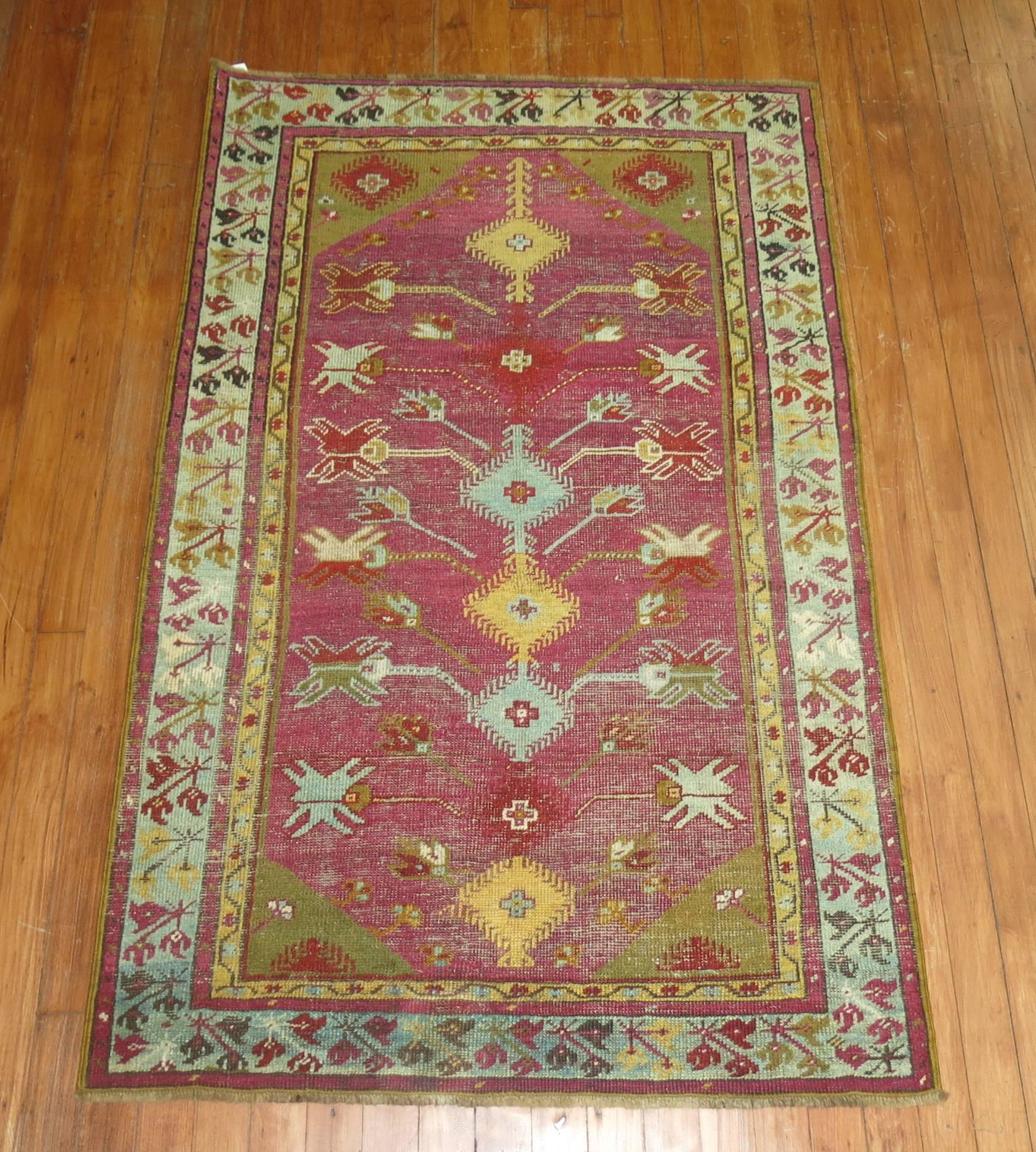 A late 19th-century whimsical Turkish Ghiordes rug.

2'11' x 4'8''