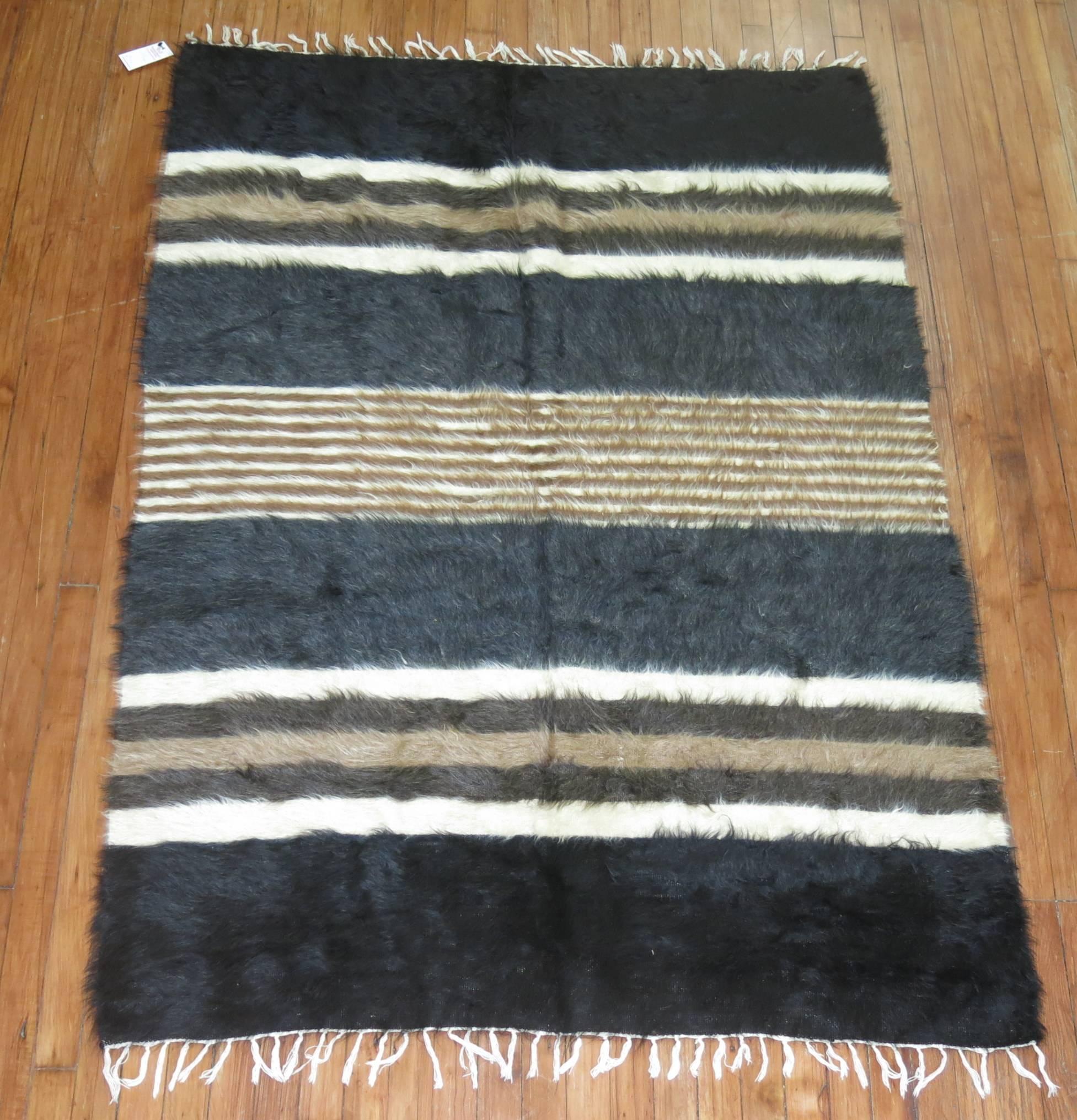 A vintage Turkish mohair rug in black, brown, gray and ivory accents with a Mid-Century Modern organic feel,

circa third quarter 20th century. Measures: 4'2