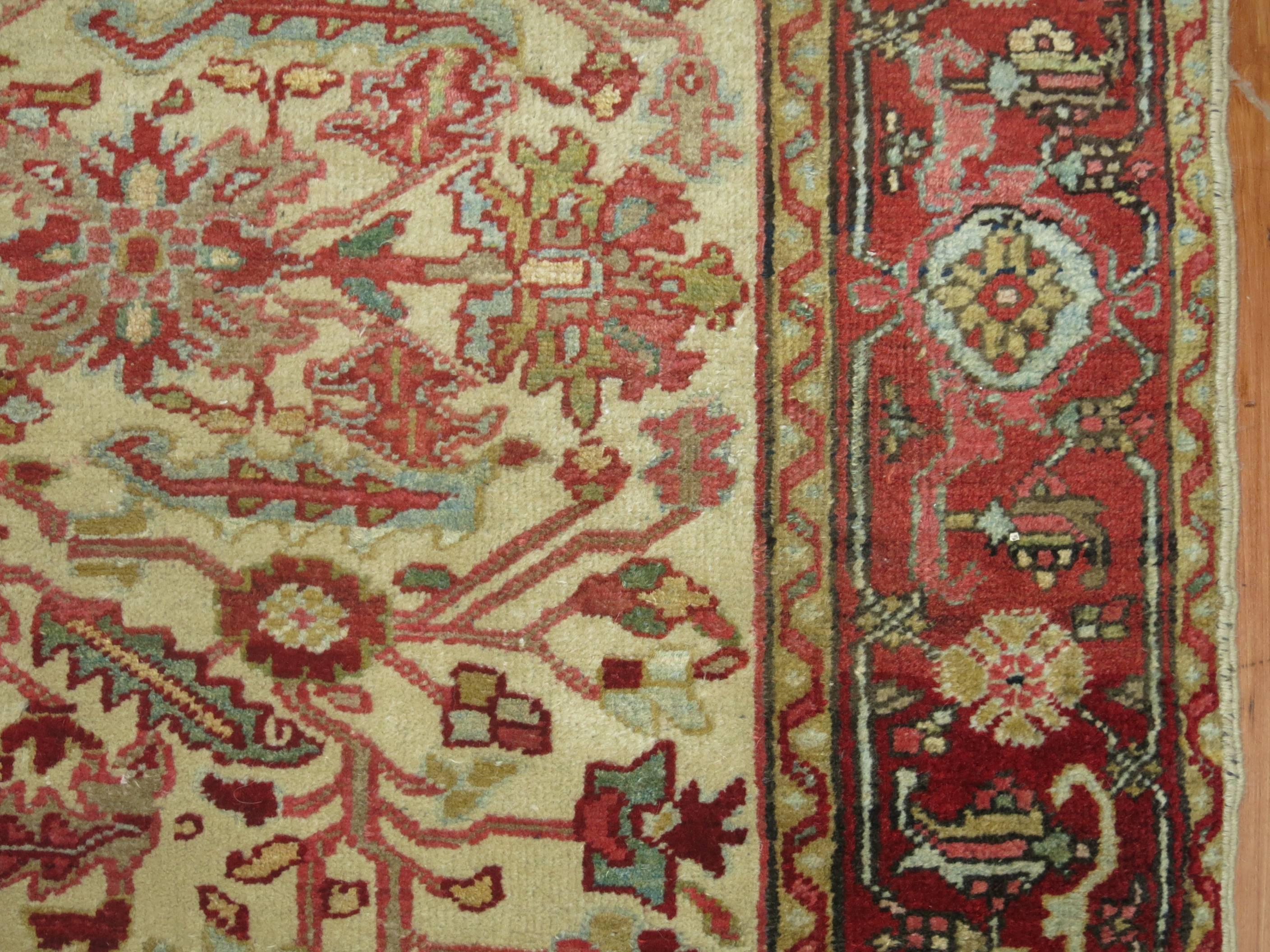 Rare size Persian Heriz carpet with an ivory ground and red border.