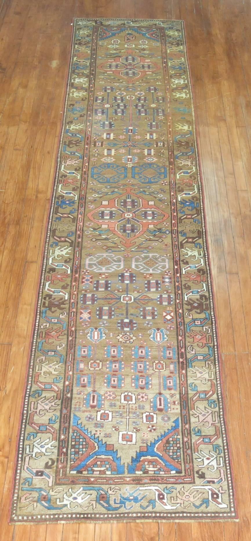 An early 20th century Tribal Persian Bakshaish runner in browns and blue.

Measures: 2'9