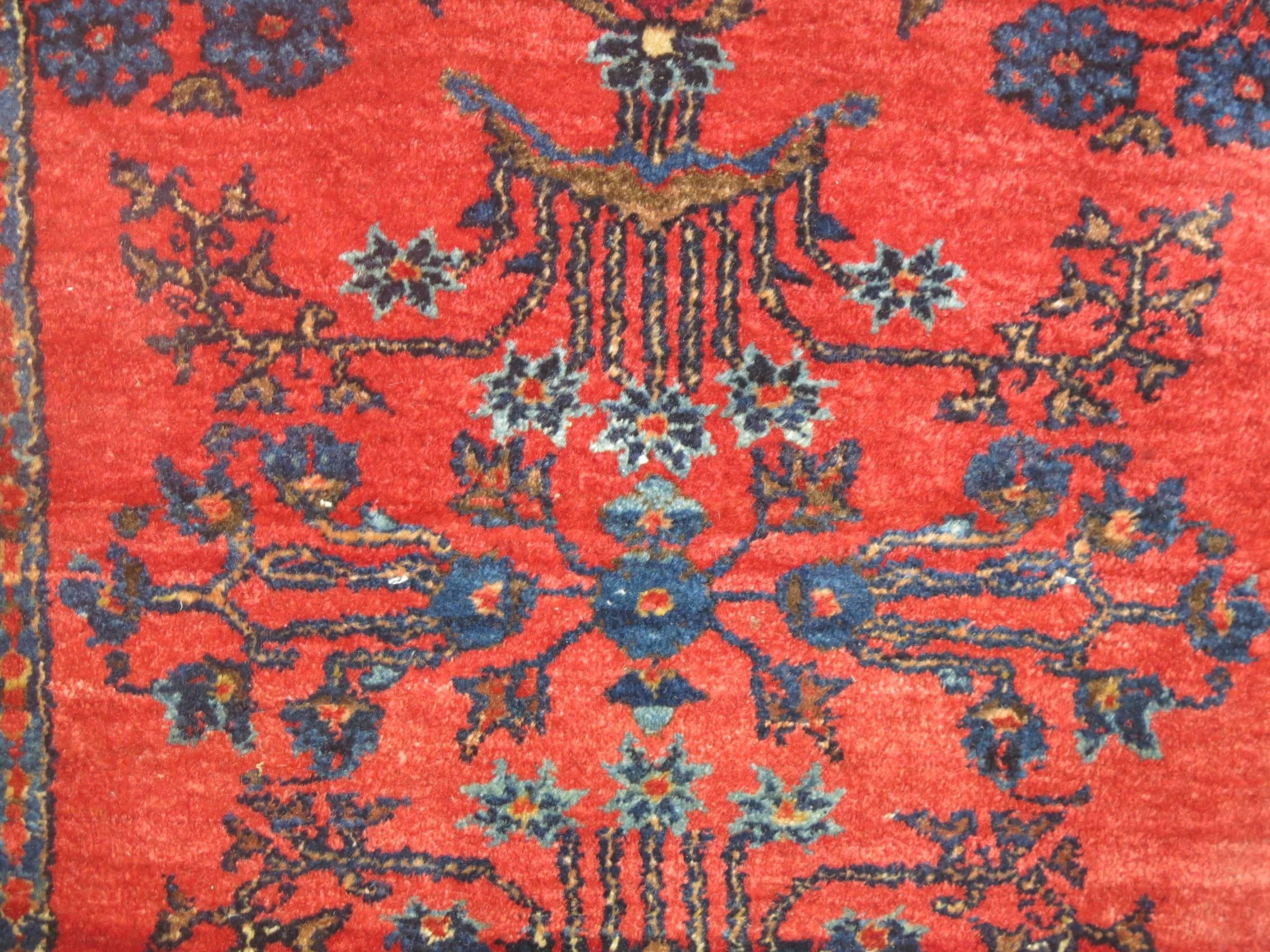 An early 20th century Classic Persian Sarouk Mohajeran quality rug in reds and blues.

Measures: 21