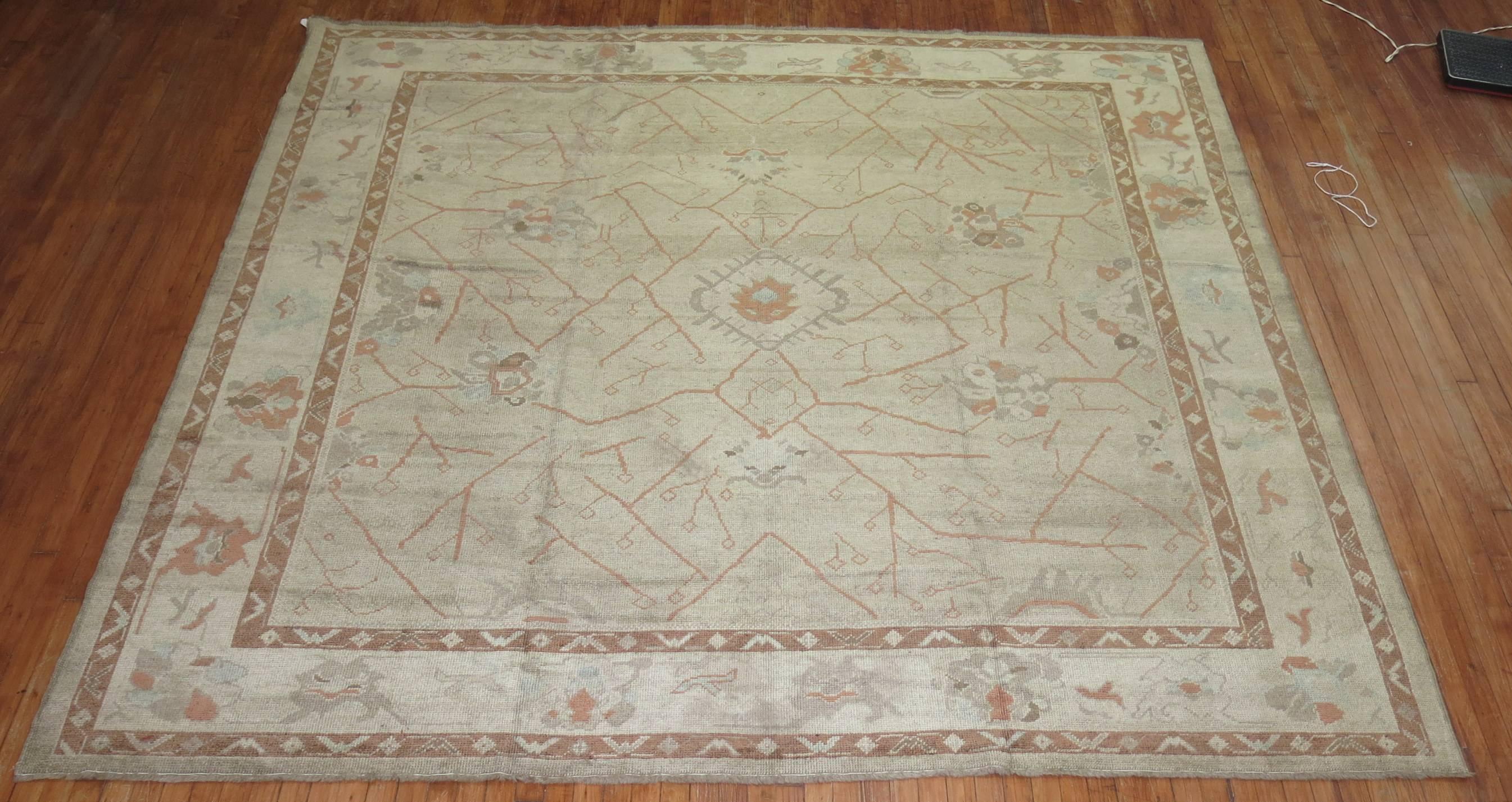 A 21st century old wool Turkish Oushak rug in gray and brown.
