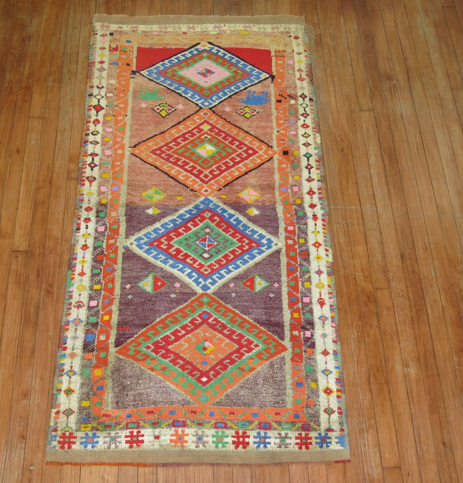 Mid-Century Turkish runner with four geometric colorful medallions. Color combination on this are so fun to decorate around which makes it quite a unique find.