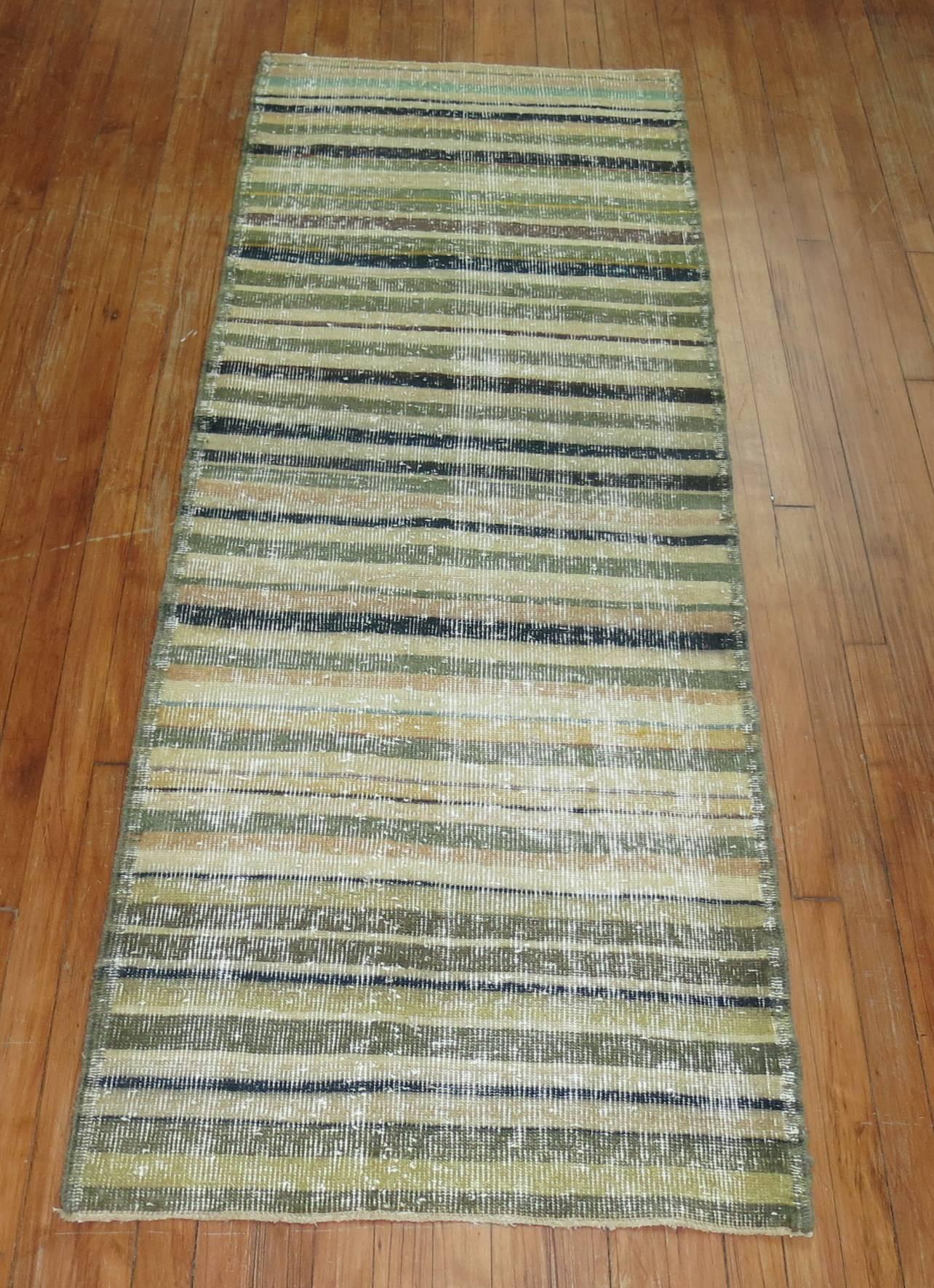 Mid-Century Turkish rug with a striped design with different shades in green and brown.