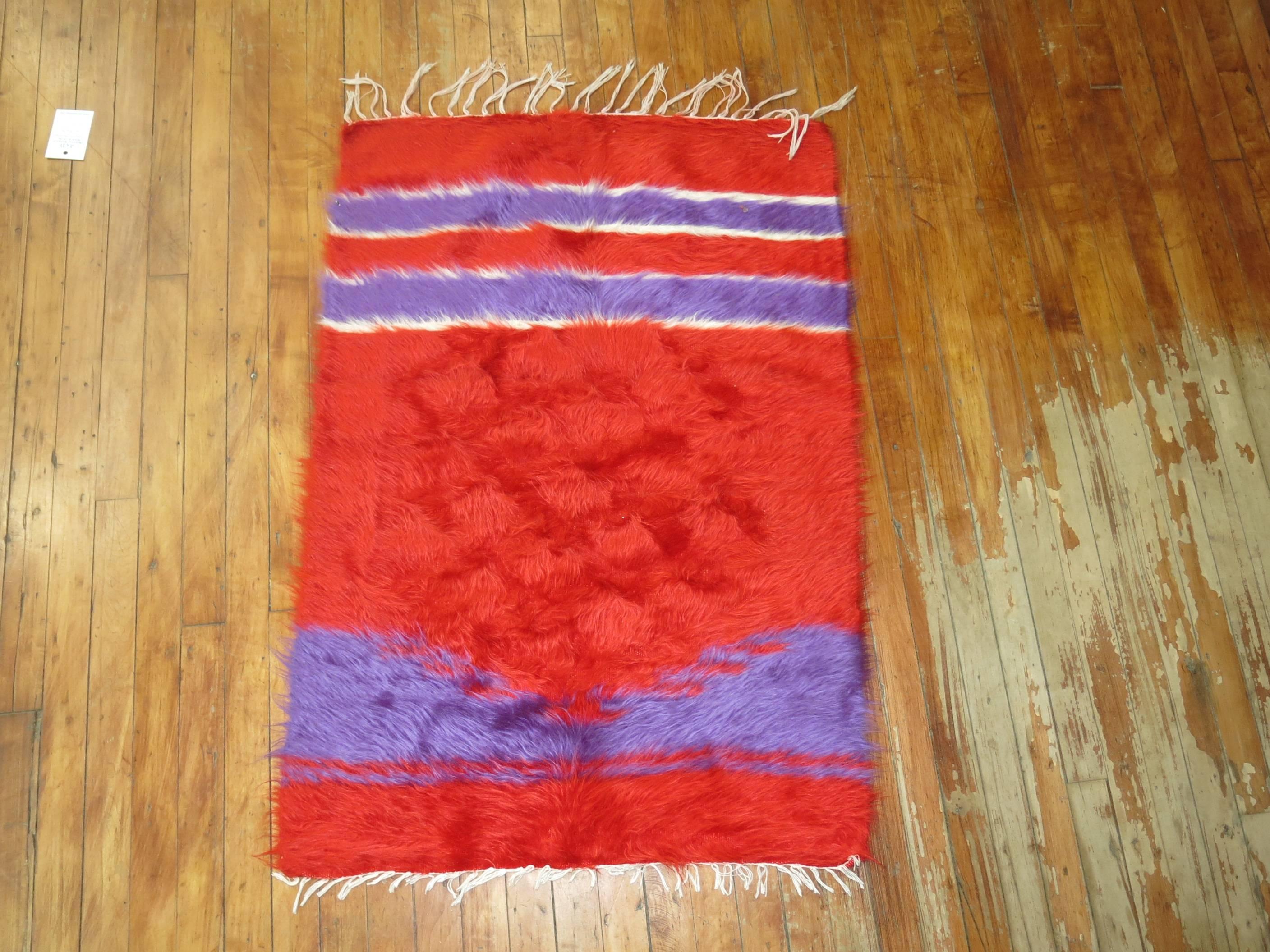 Rare color handwoven mohair wool rug in bright reds and purple.

Measures: 2'6