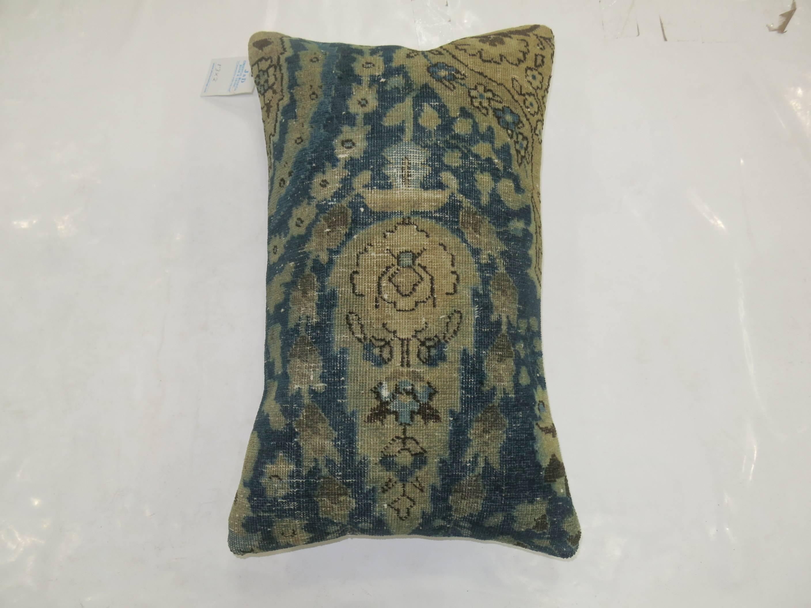 Bolster size pillow made from vintage Persian Tabriz rug.