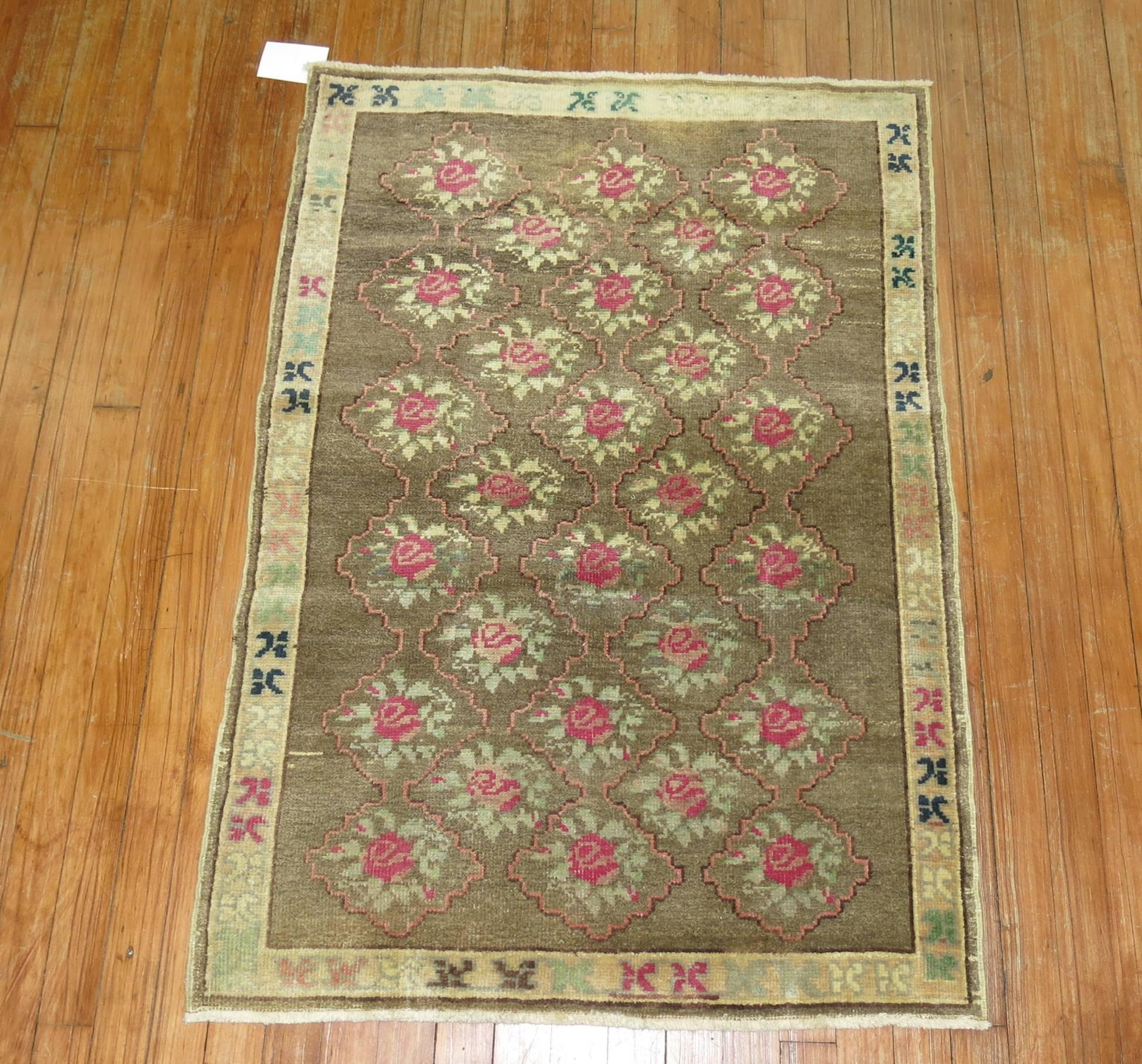 Feminine style mid-20th century Turkish Konya village rug.