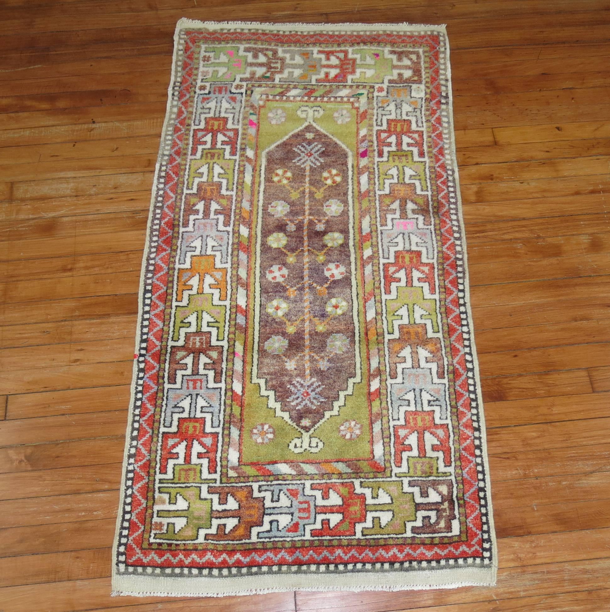 Colorful vintage Turkish Anatolian throw size rug.