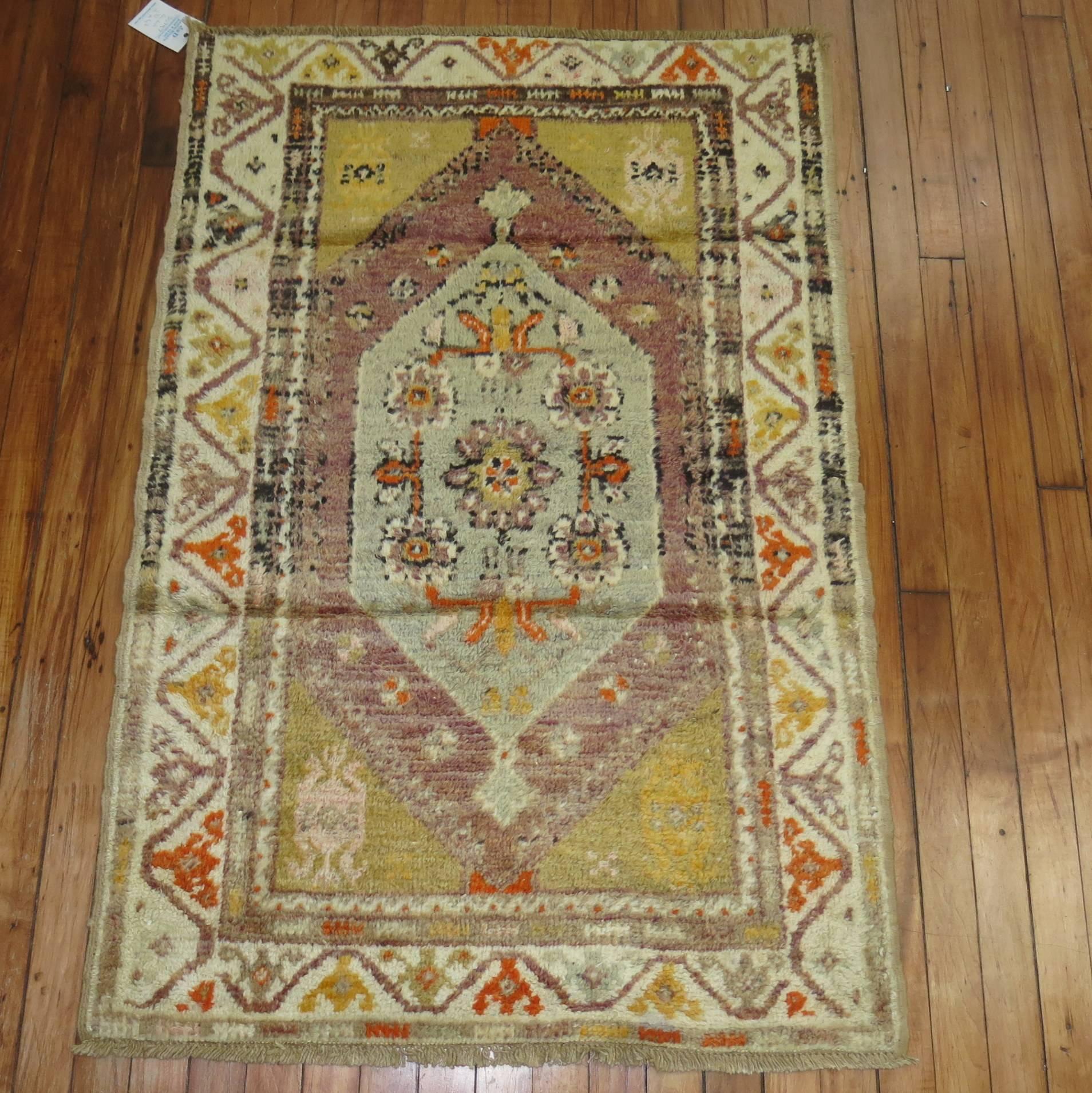 Vintage Anatolian throw rug highlighted by a lavender colored ground.