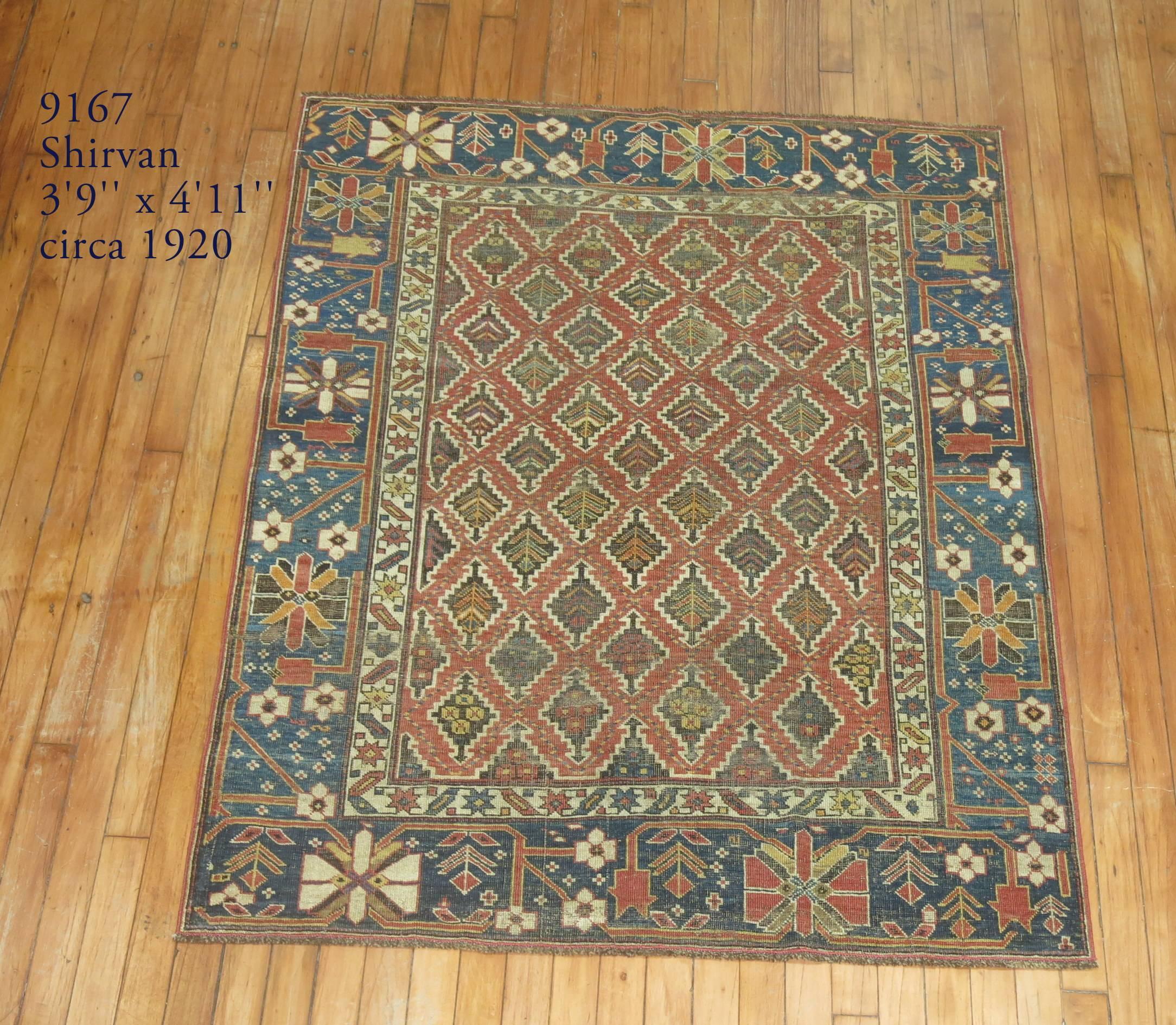 A late 19th century shabby chic Caucasian rug. Rustic colors throughout with a tribal vibe throughout the border and the field.

Size: 3'9” x 4'11”.