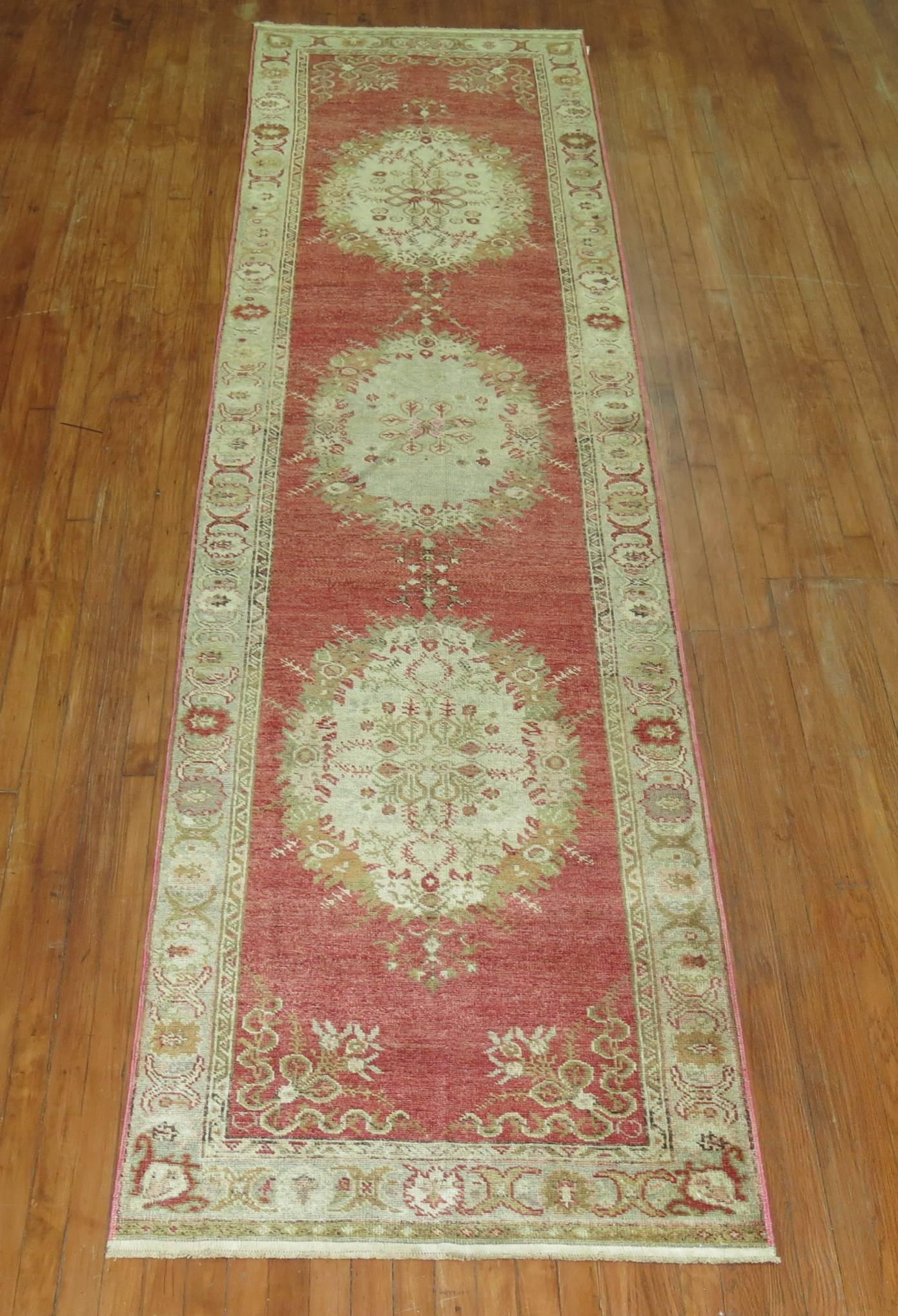 Classic vintage Oushak runner with three medallions occupied by an elaborate border.