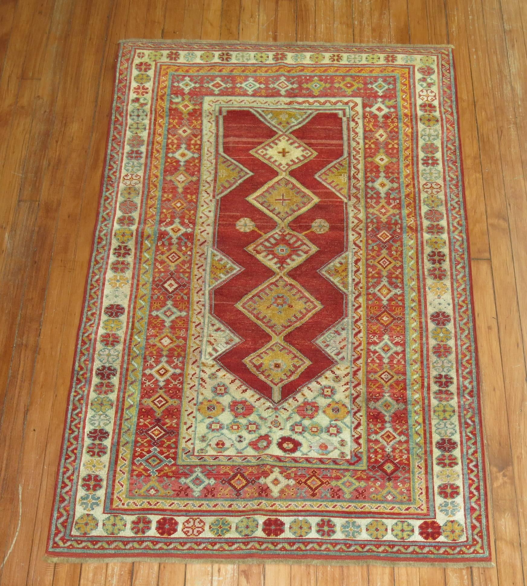 Colorful fine quality early 20th century Turkish Melas rug. Rich red and icy blue color accents.