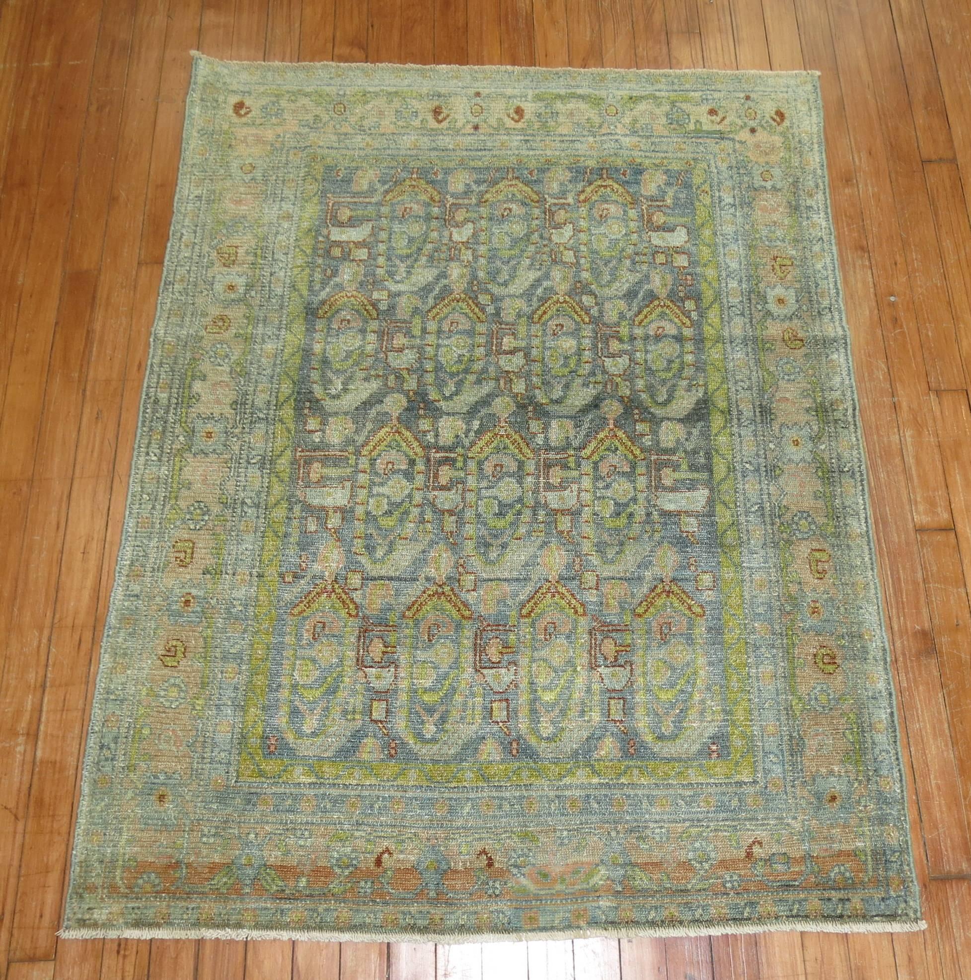 An early 20th century Persian Malayer rug with unusual chartreuse color accents on a blue field.

Measures: 3'6'' x 4'7''.

 