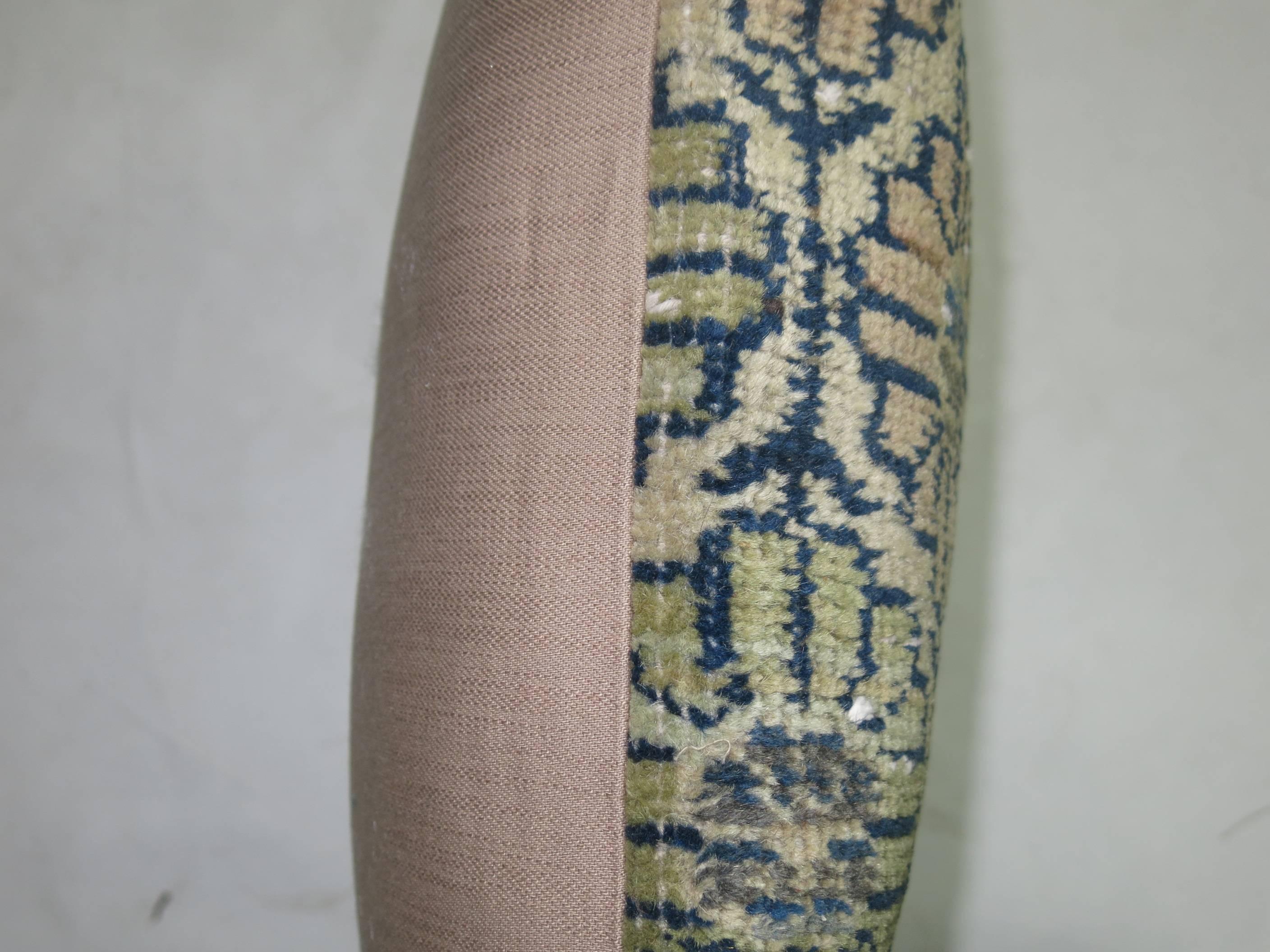 Bolster size pillow made from a turkish deco rug