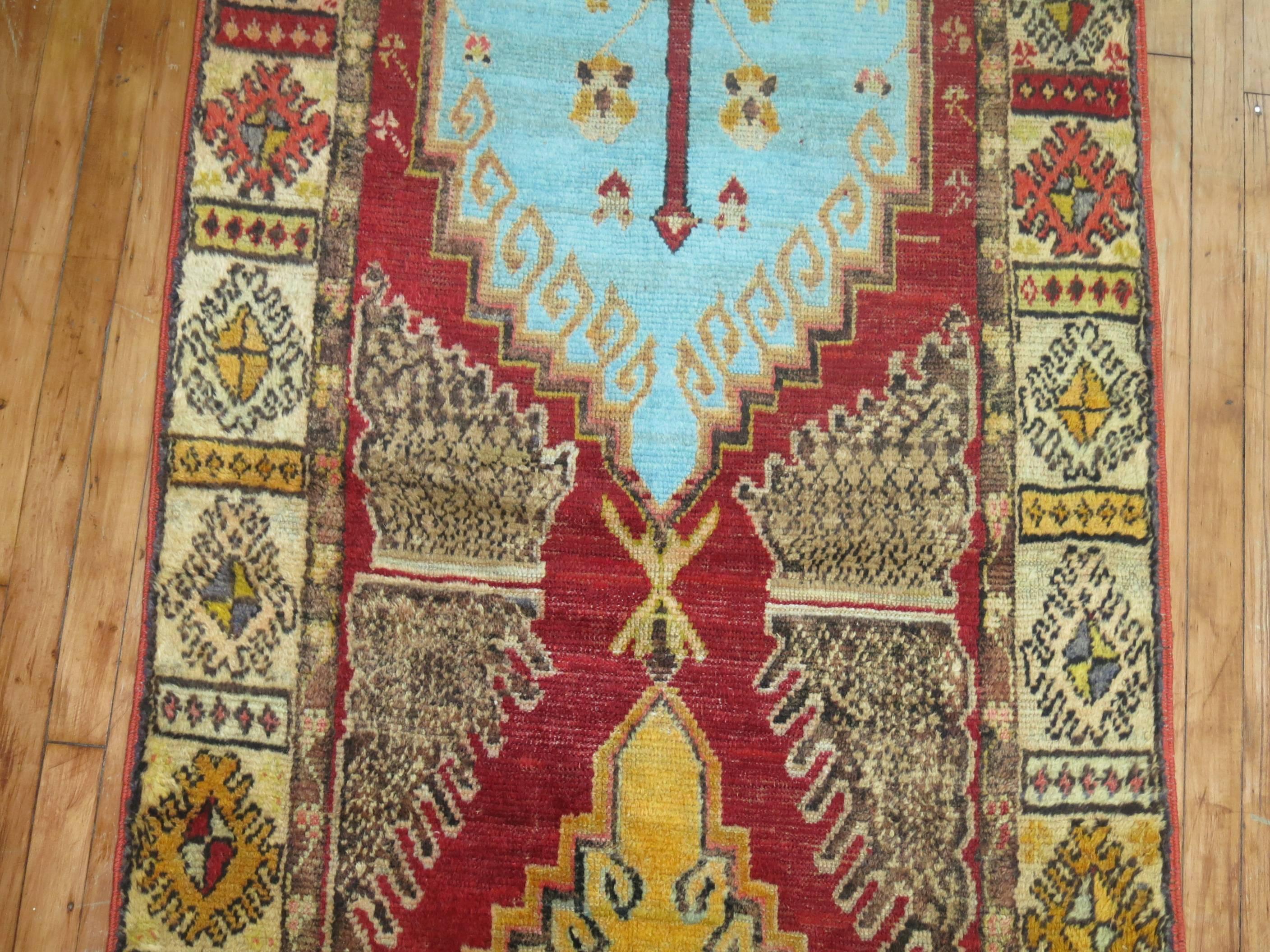20th Century Red Field Anatolian Oushak Runner with Electric Blue and Gold Medallions For Sale