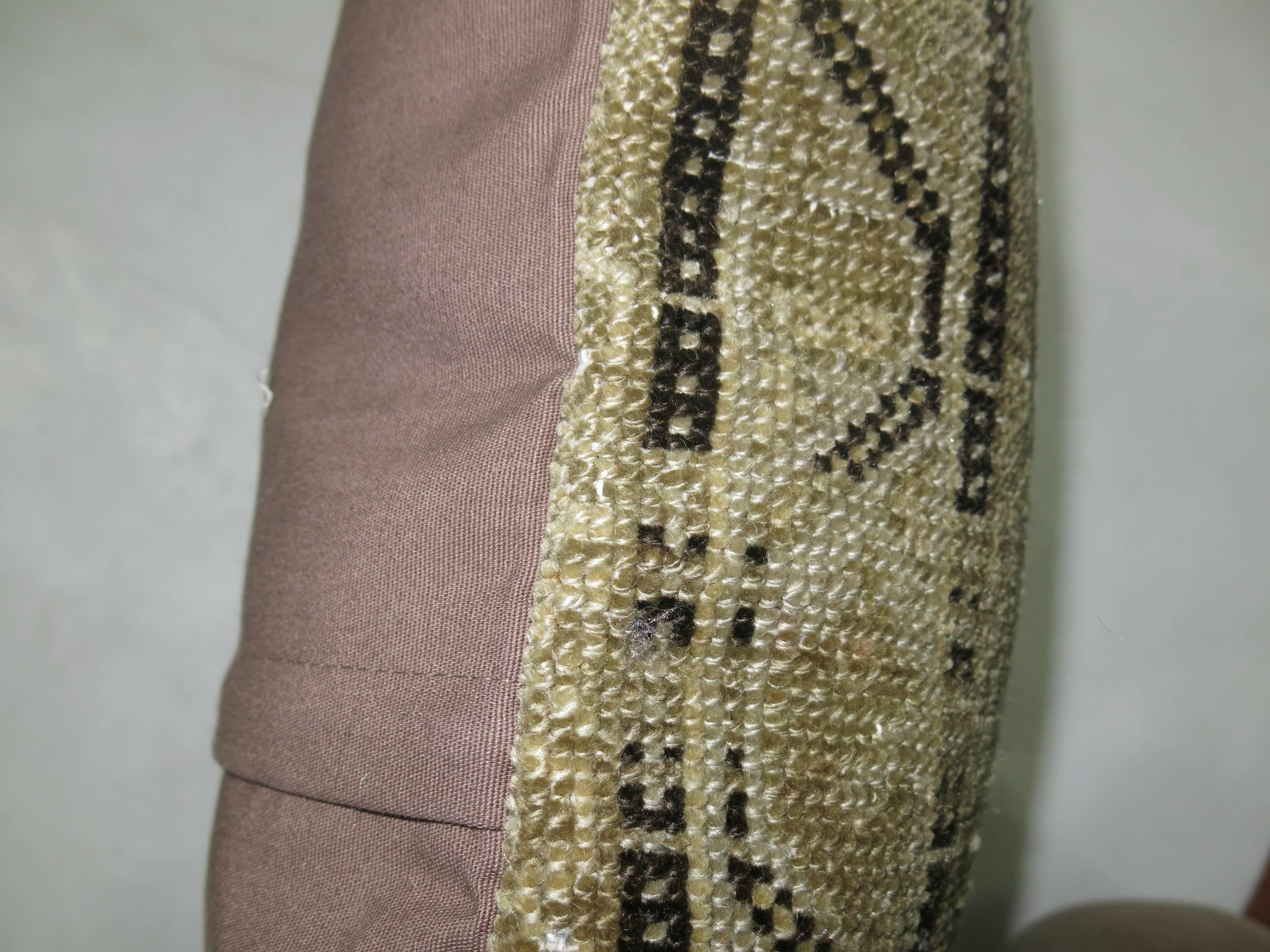 Pillow made from a washed out Persian Malayer rug.