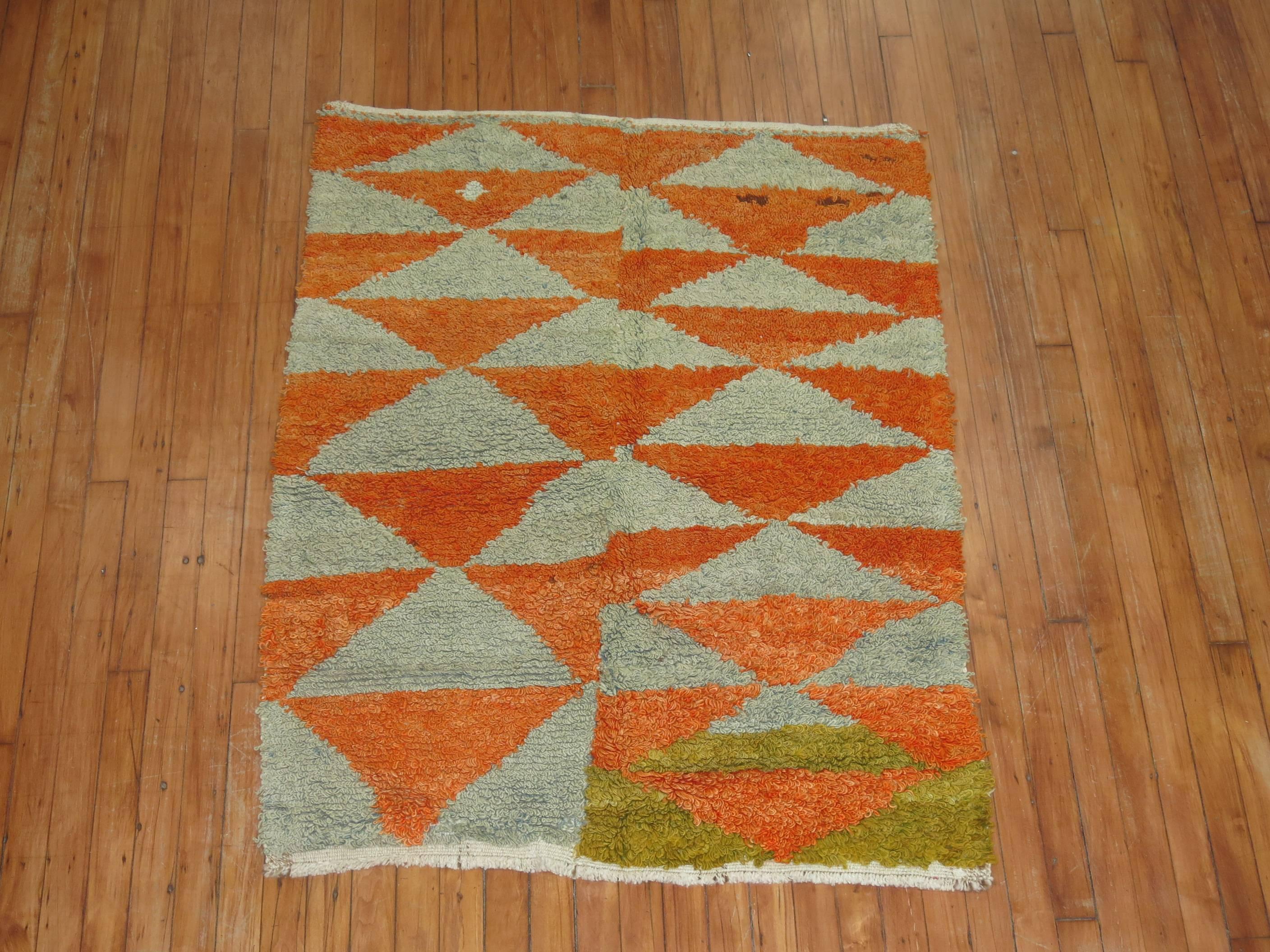 A Turkish Konya shag rug featuring an intense orange color, circa mid-20th century.

Measures: 3'4