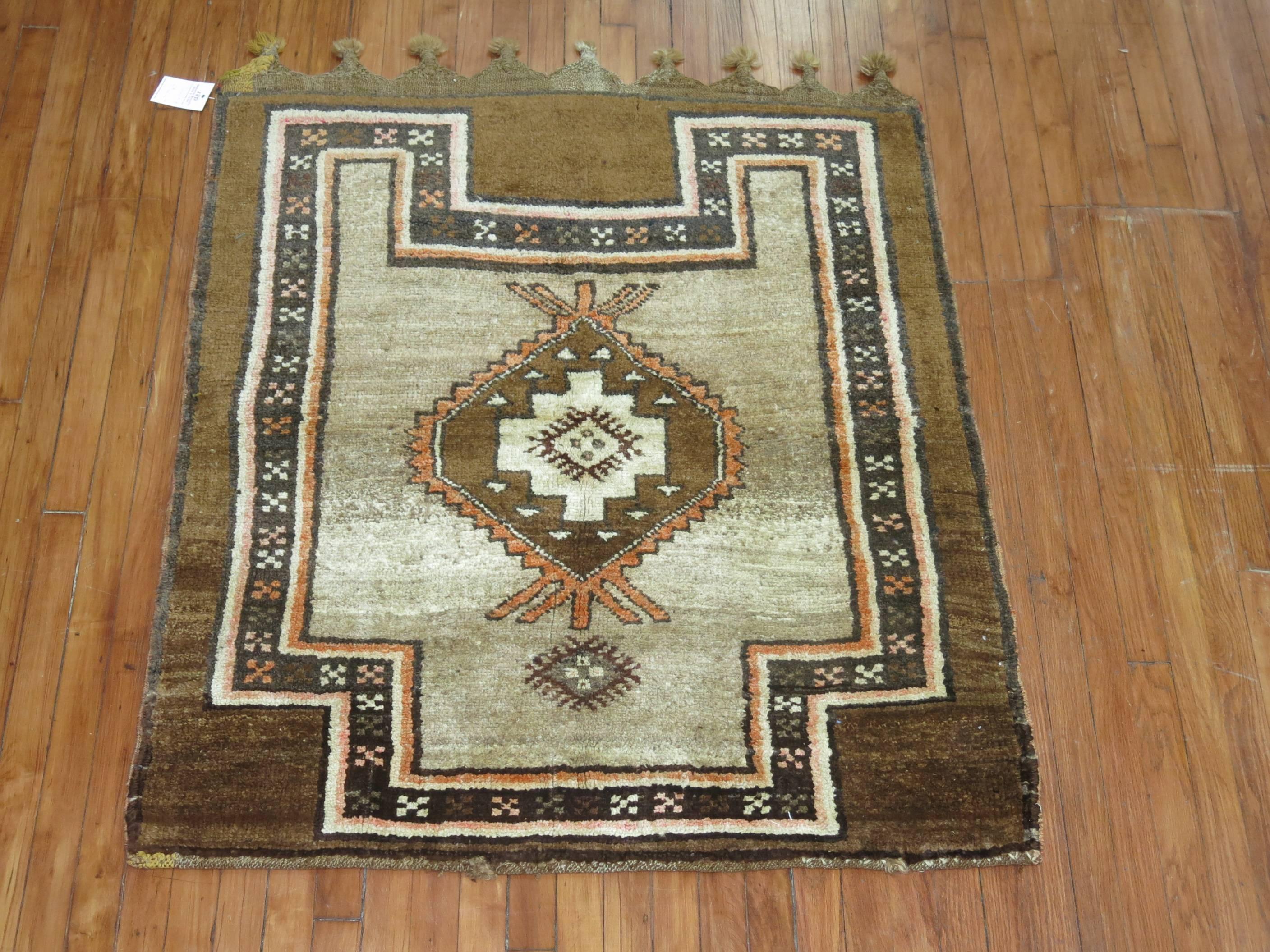 Vintage Turkish tribal throw rug featuring thick fringes in one end,

circa mid-20th century, measures: 3'8